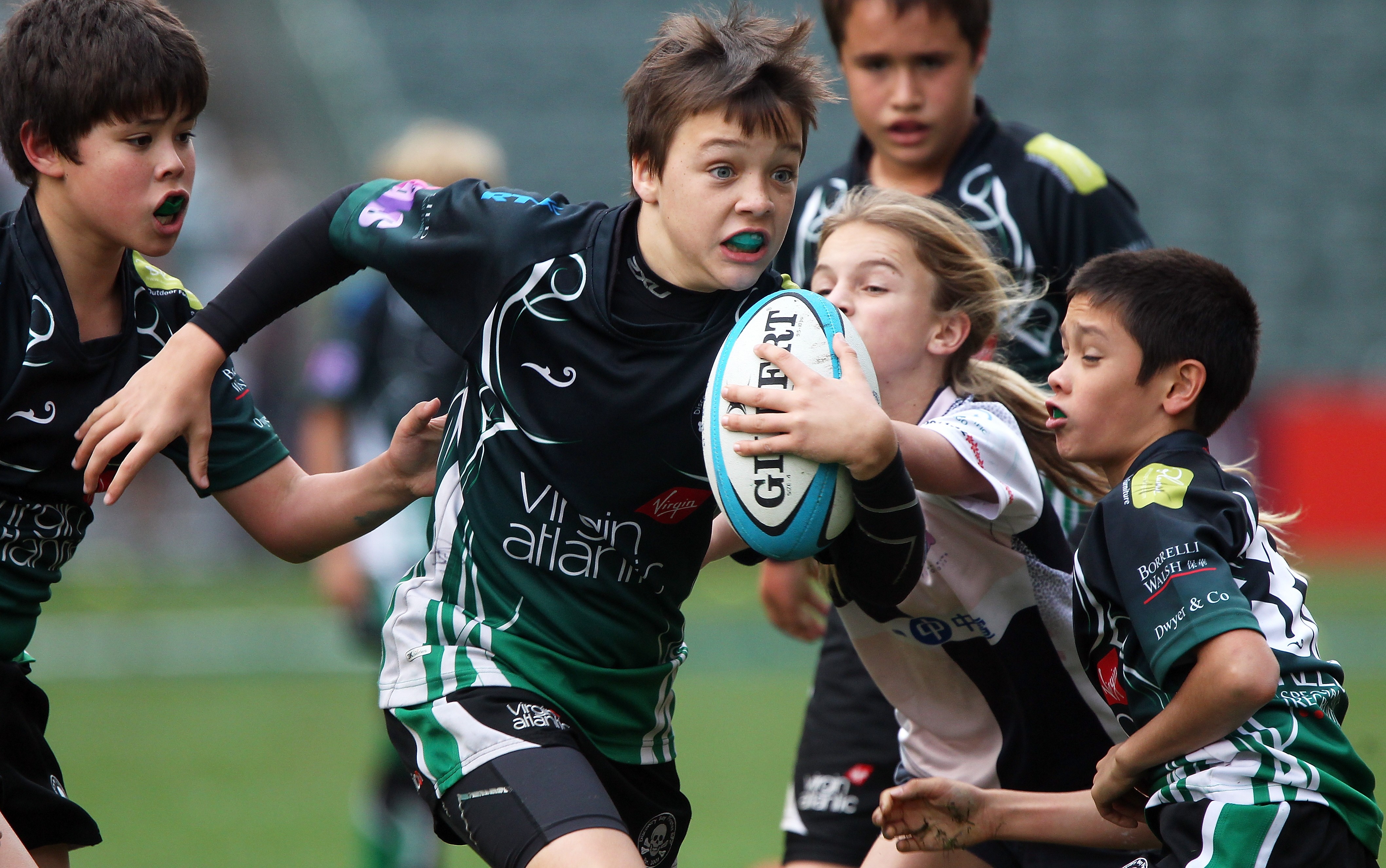 Hong Kong kids in action at the Sevens – but if some parents get there way, “harmful contact” would be banned from youth rugby. Photo: Nora Tam