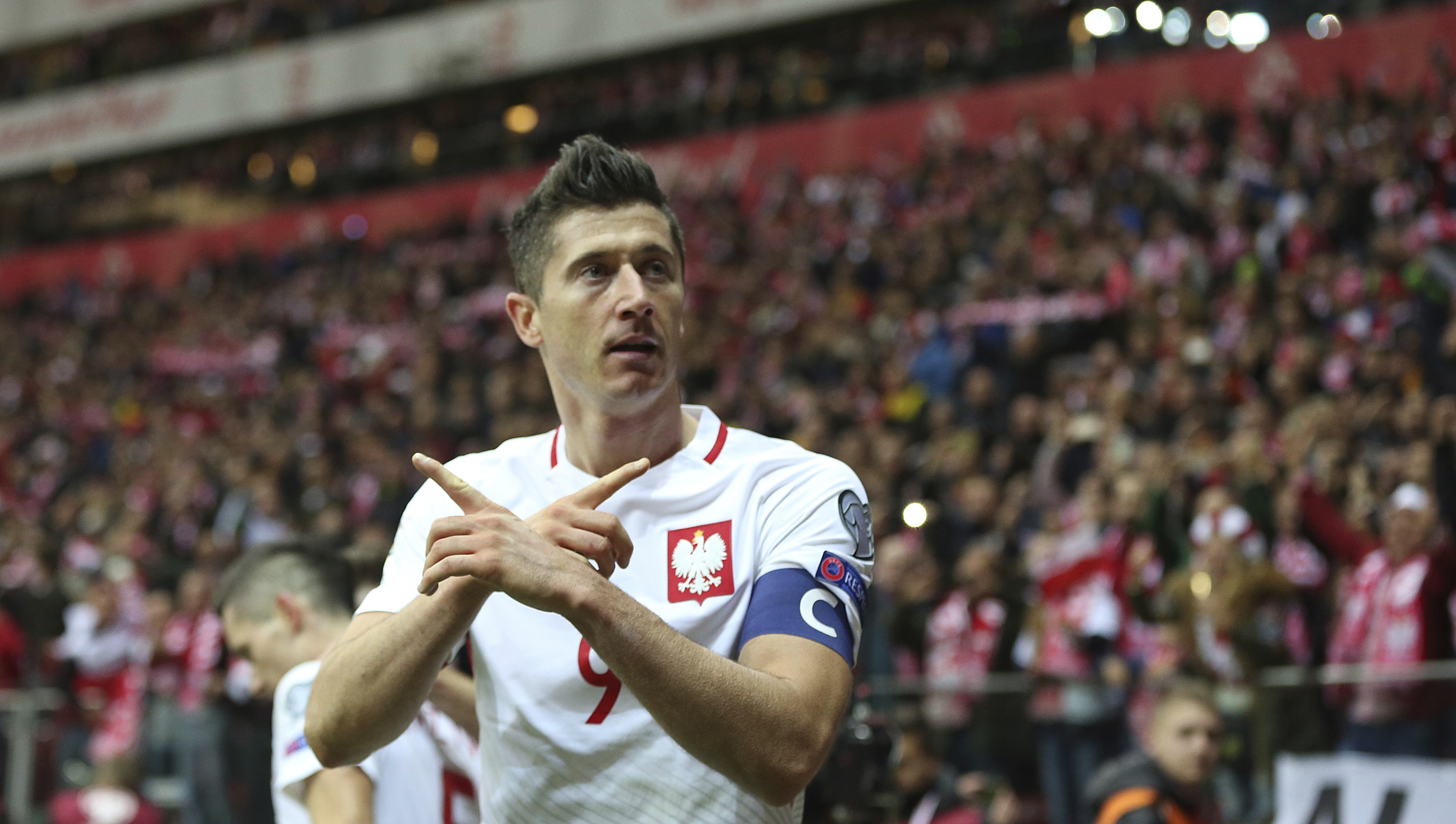 Poland’s Robert Lewandowski reacts after he scored a goal during the World Cup group E qualifier against Montenegro. Photo: AP
