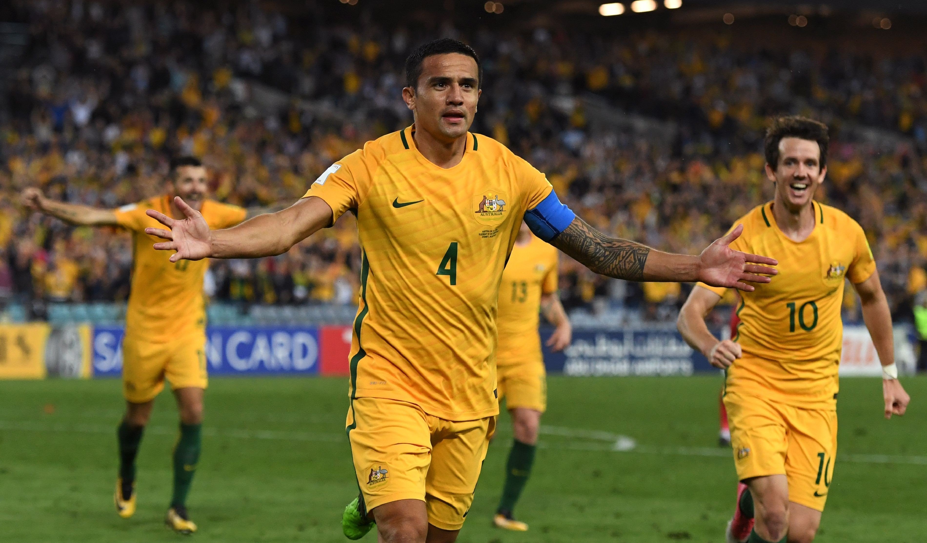 Tim Cahill celebrates one of his two goals against Syria. Photos: AFP