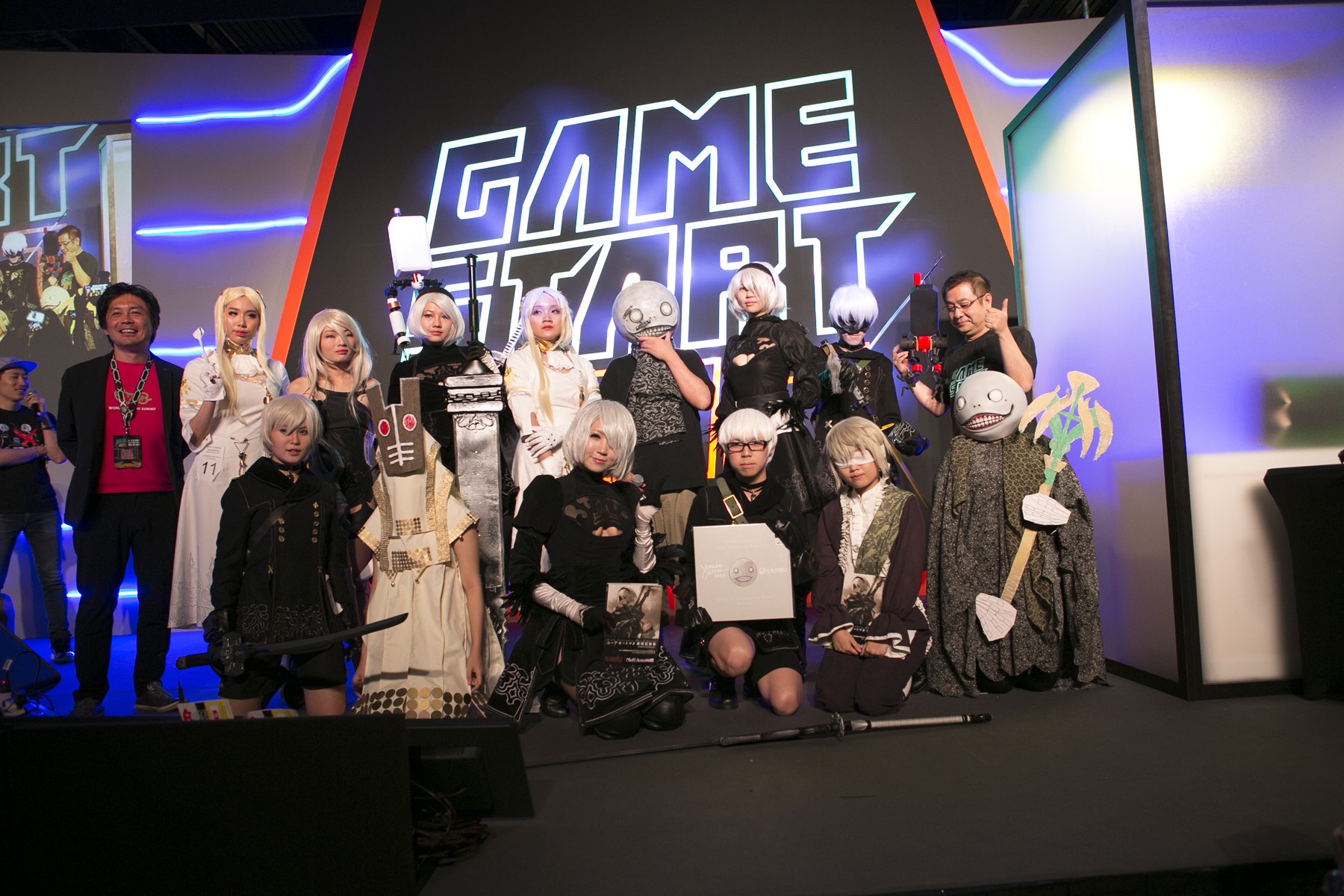 Cosplayers dressing up as characters from the video game Nier wait for judging at Singapore’s GameStart Asia convention.