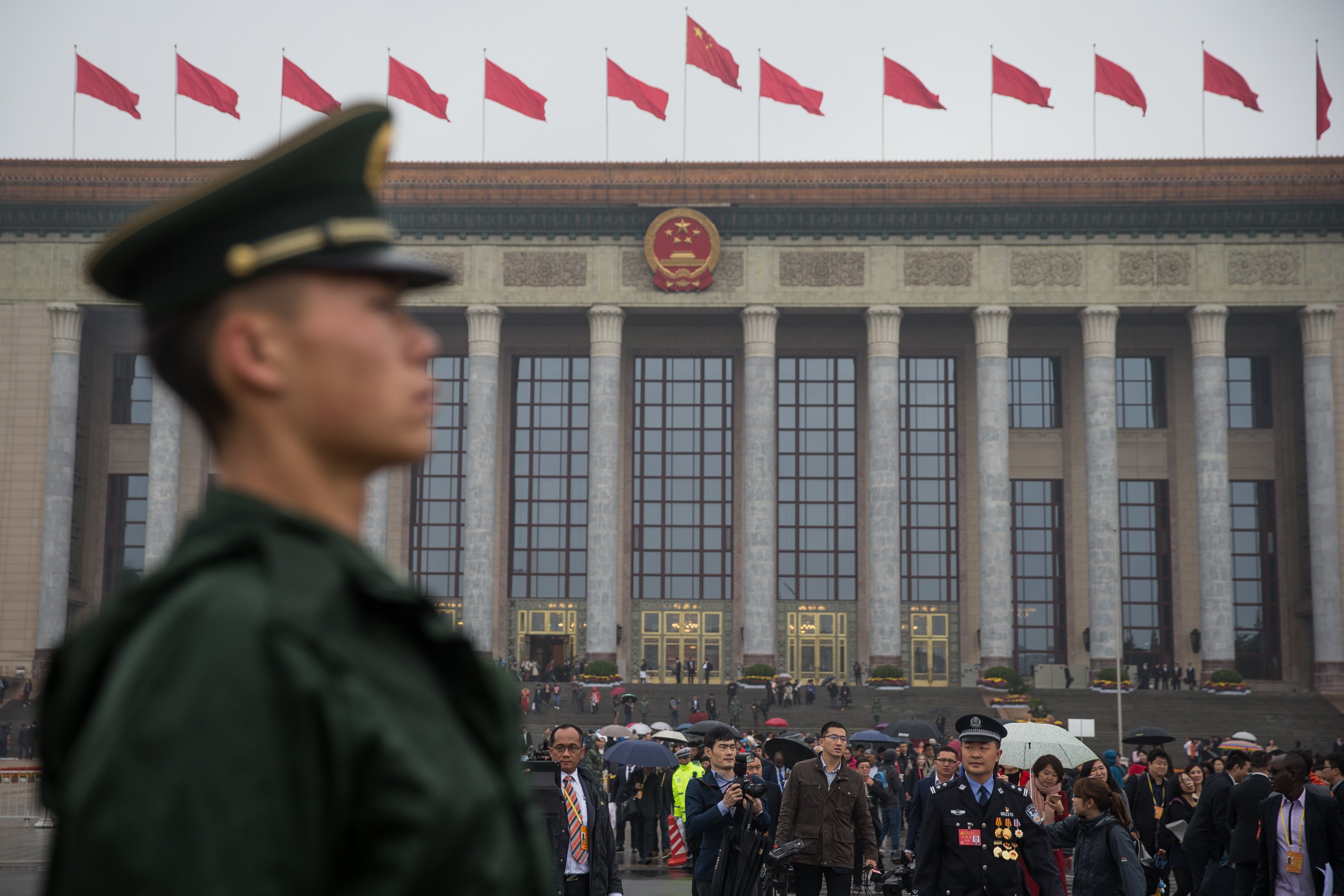 Delegates leave the Great Hall of the People in Beijing on Wednesday at the end of the opening session of the 19th National Congress of the Communist Party of China. Photo: EPA