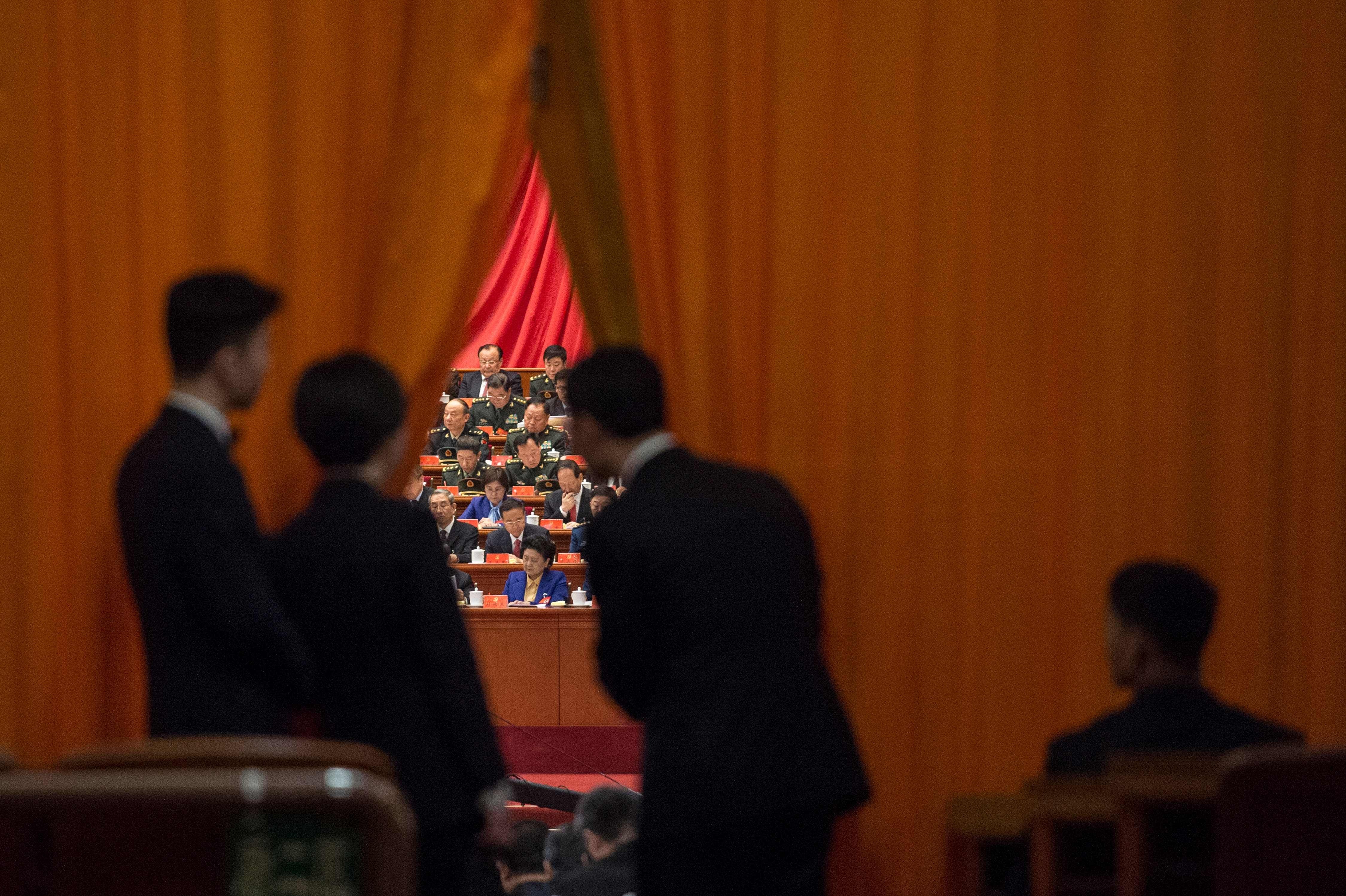 Security guards take a look at military delegates during President Xi Jinping’s speech at the 19th party congress in Bejing on October 18, in which he stressed the country’s many achievements and made clear that he believed China was on the precipice of becoming a “great” global power. Photo: AFP