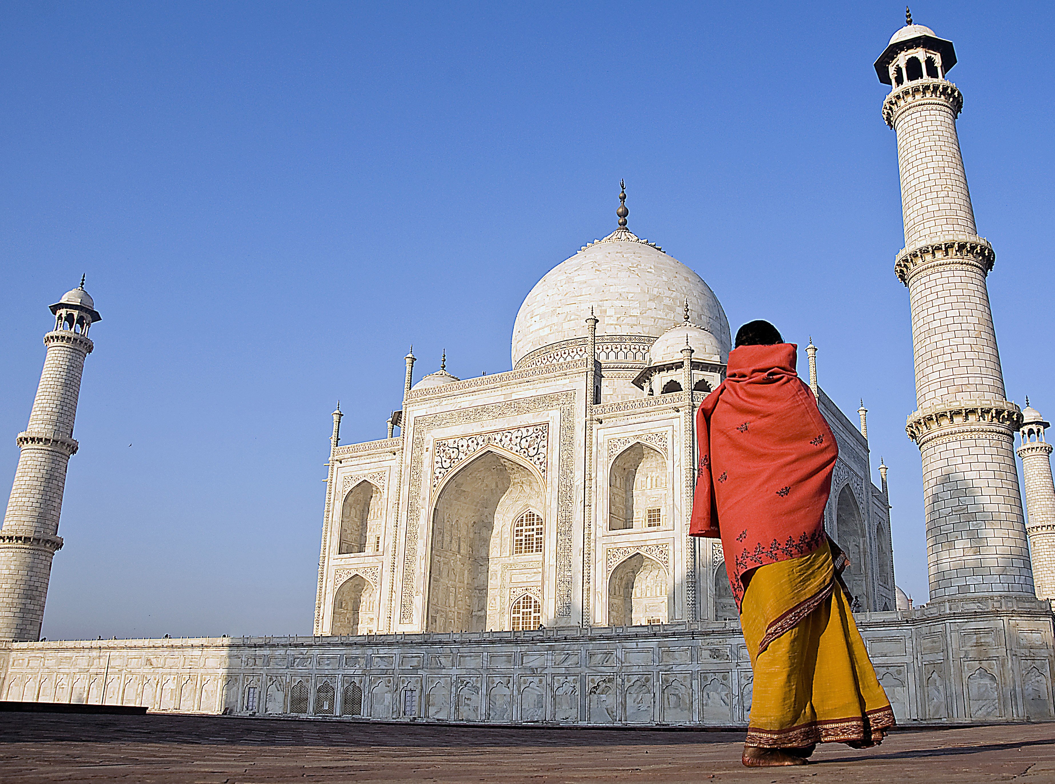 A woman looks up at the facade of the Taj Mahal in Agra, India. Photo: Post Magazine