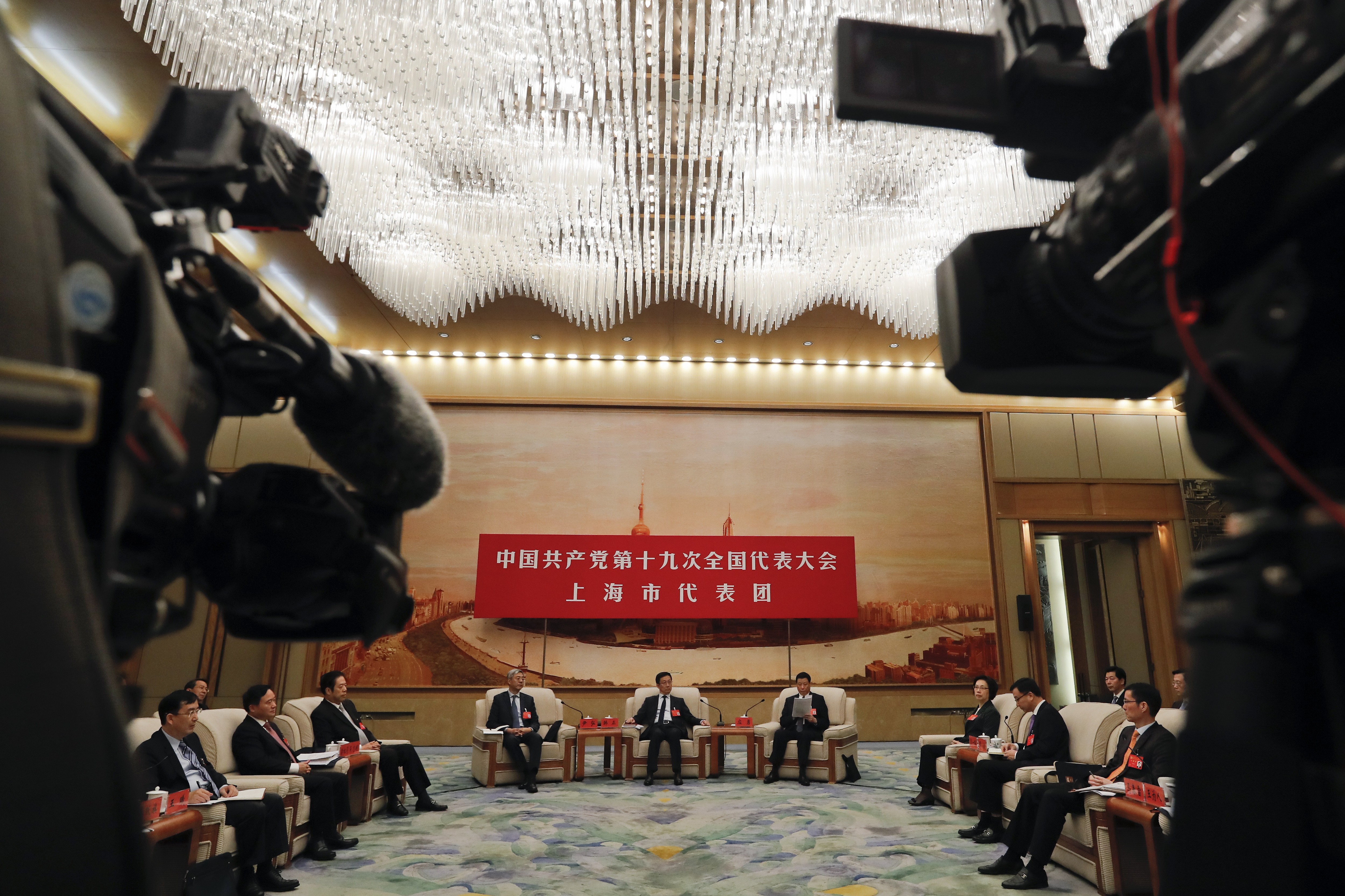 The Shanghai delegation, including party chief Han Zheng (centre) and mayor Ying Yong (right) discuss Xi Jinping’s work report at the Great Hall of the People in Beijing on Thursday. Photo: AP