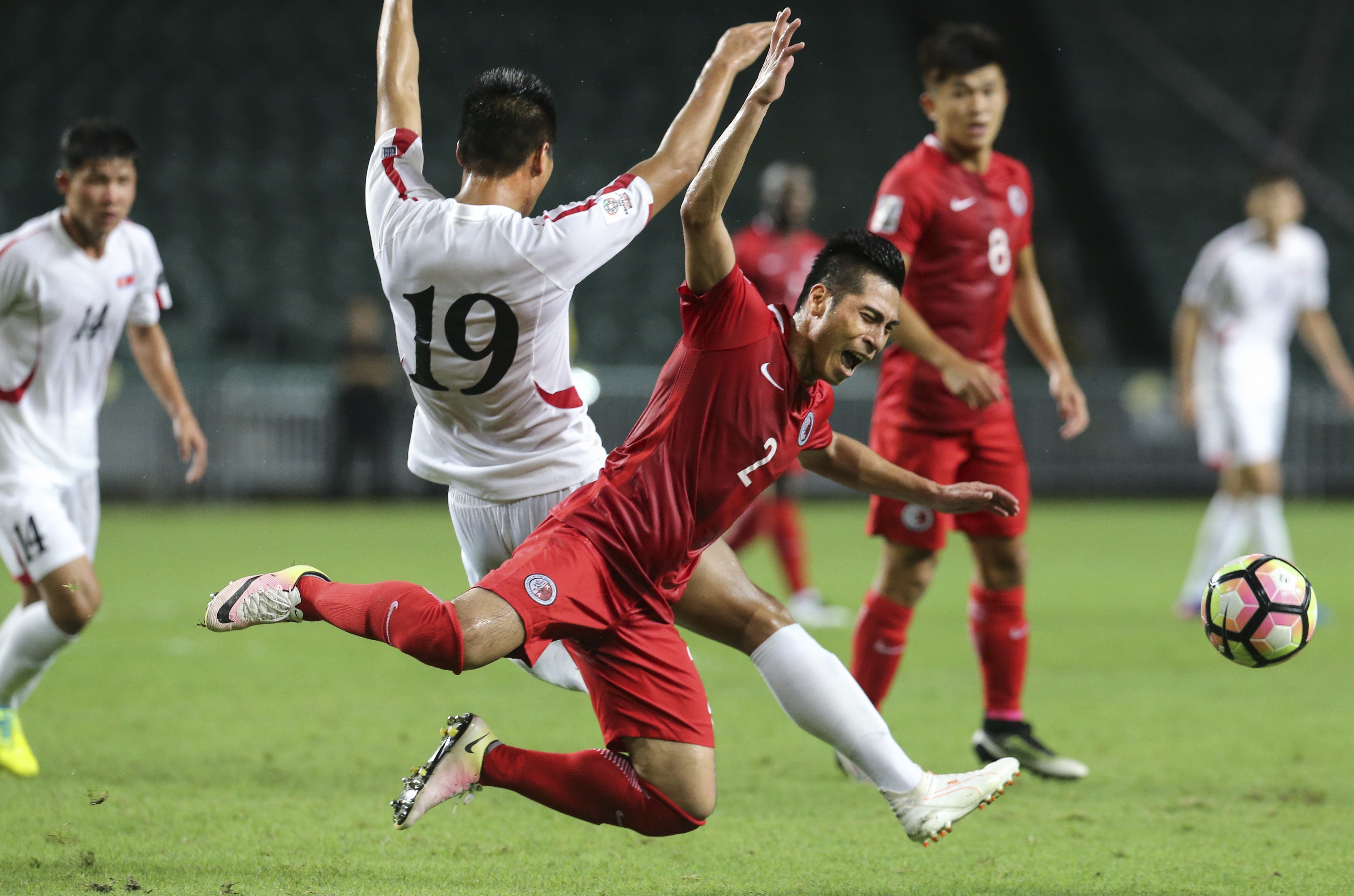 Action between Hong Kong (red) and North Korea in Asian Cup qualifiers. Photo: Felix Wong