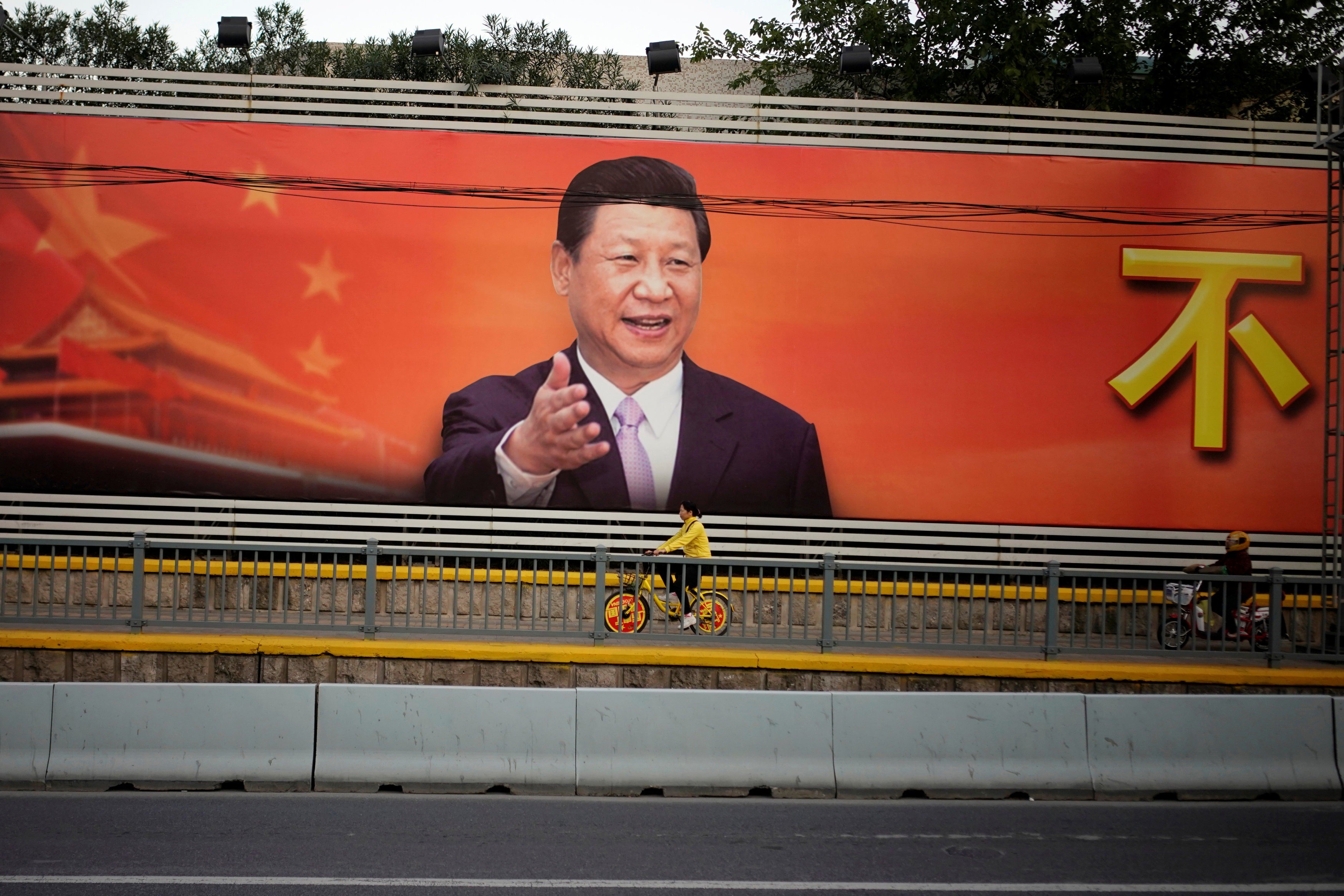A poster with a portrait of President Xi Jinping is displayed along a street in Shanghai, on October 24. A political system that is highly centralised, ideologically driven, under one charismatic, almost all-powerful leader, with striking ambitions of global military grandeur and influence, carries its own dangers. Photo: Reuters