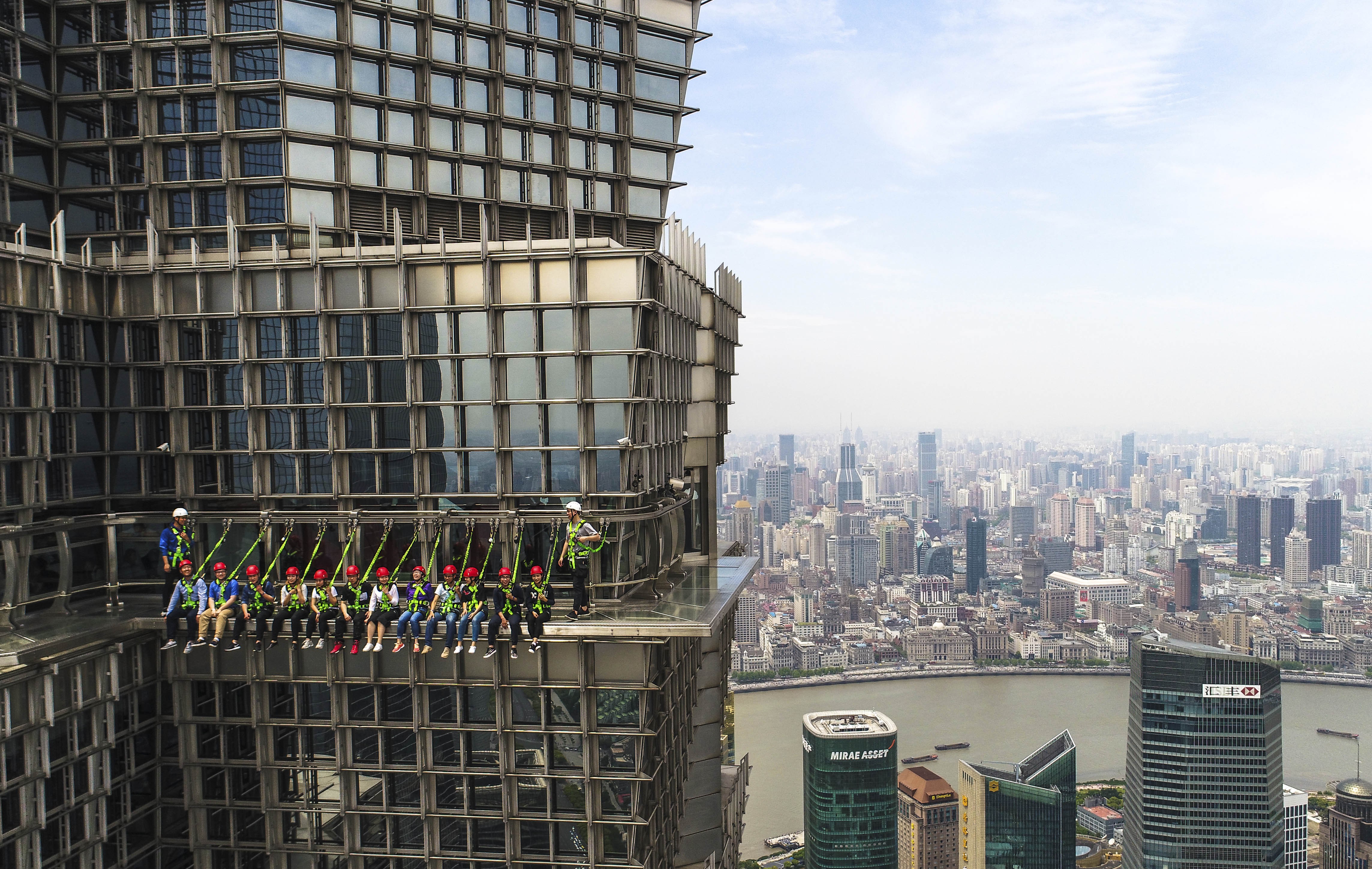 Tourists on a skywalk at Jinmao Tower in Shanghai. Photo: Xinhua