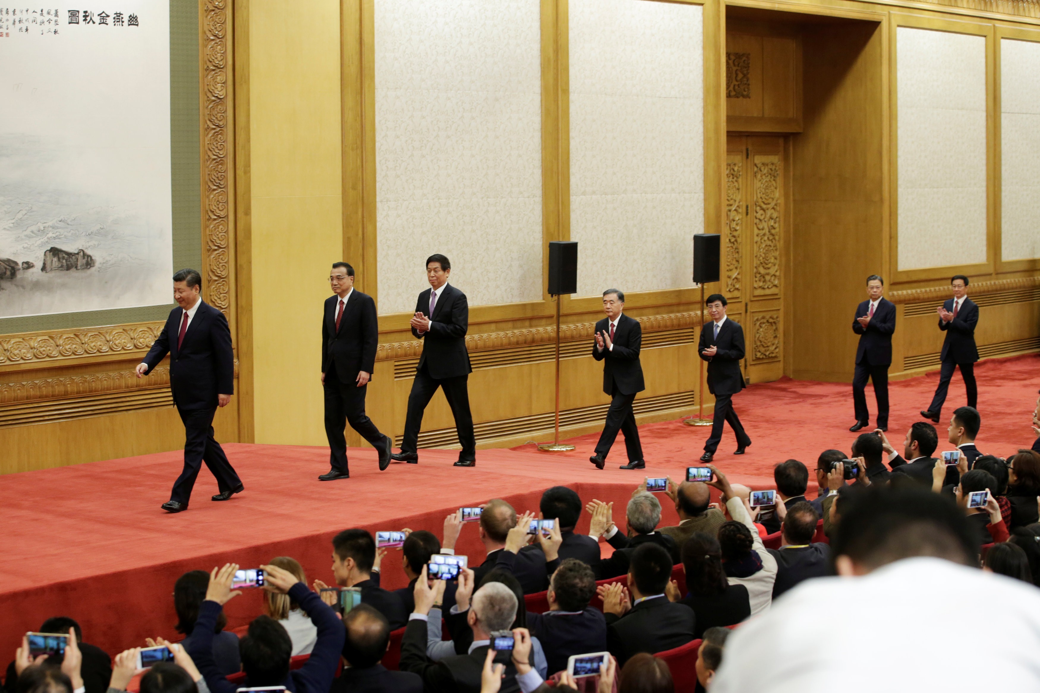 China's new Politburo Standing Committee members arrive to meet with the press at the Great Hall of the People in Beijing. Photo: Reuters