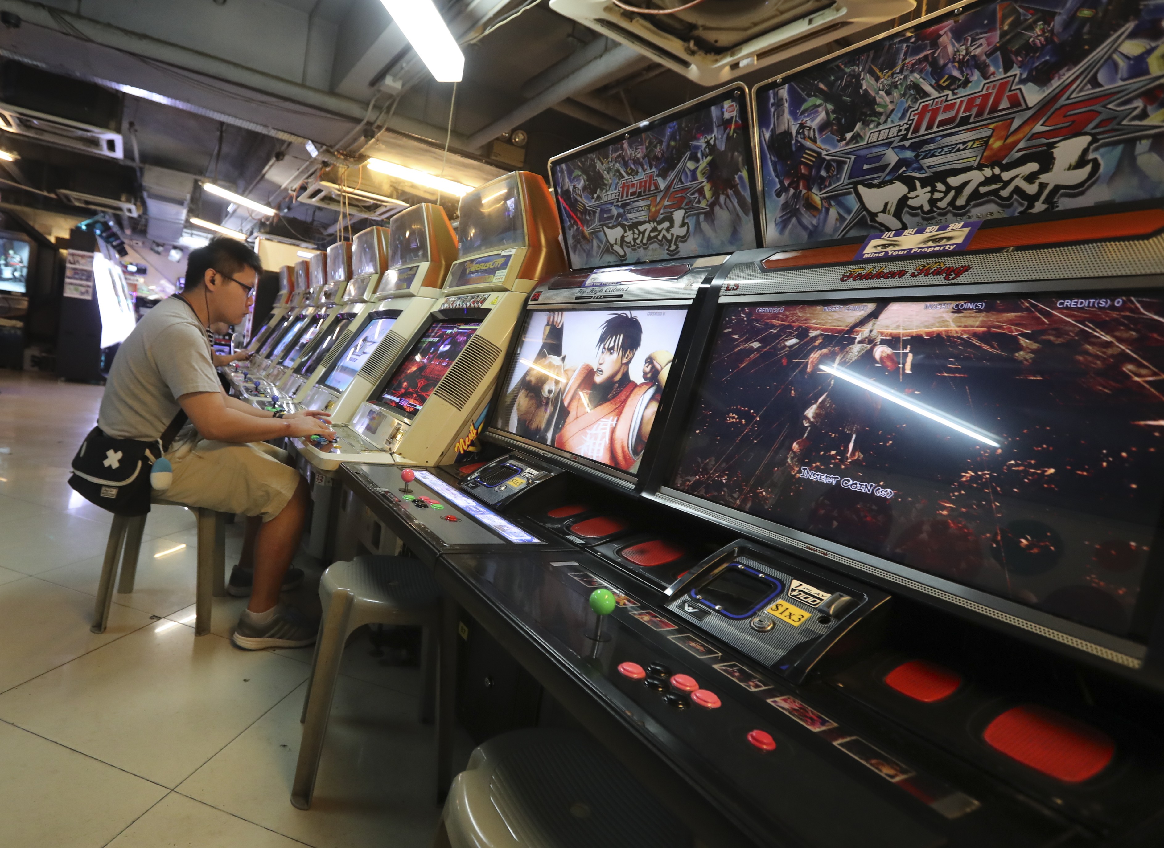 The neon-lit Gamezone in Mong Kok is typical of the old-school video arcade. Photo: Edward Wong