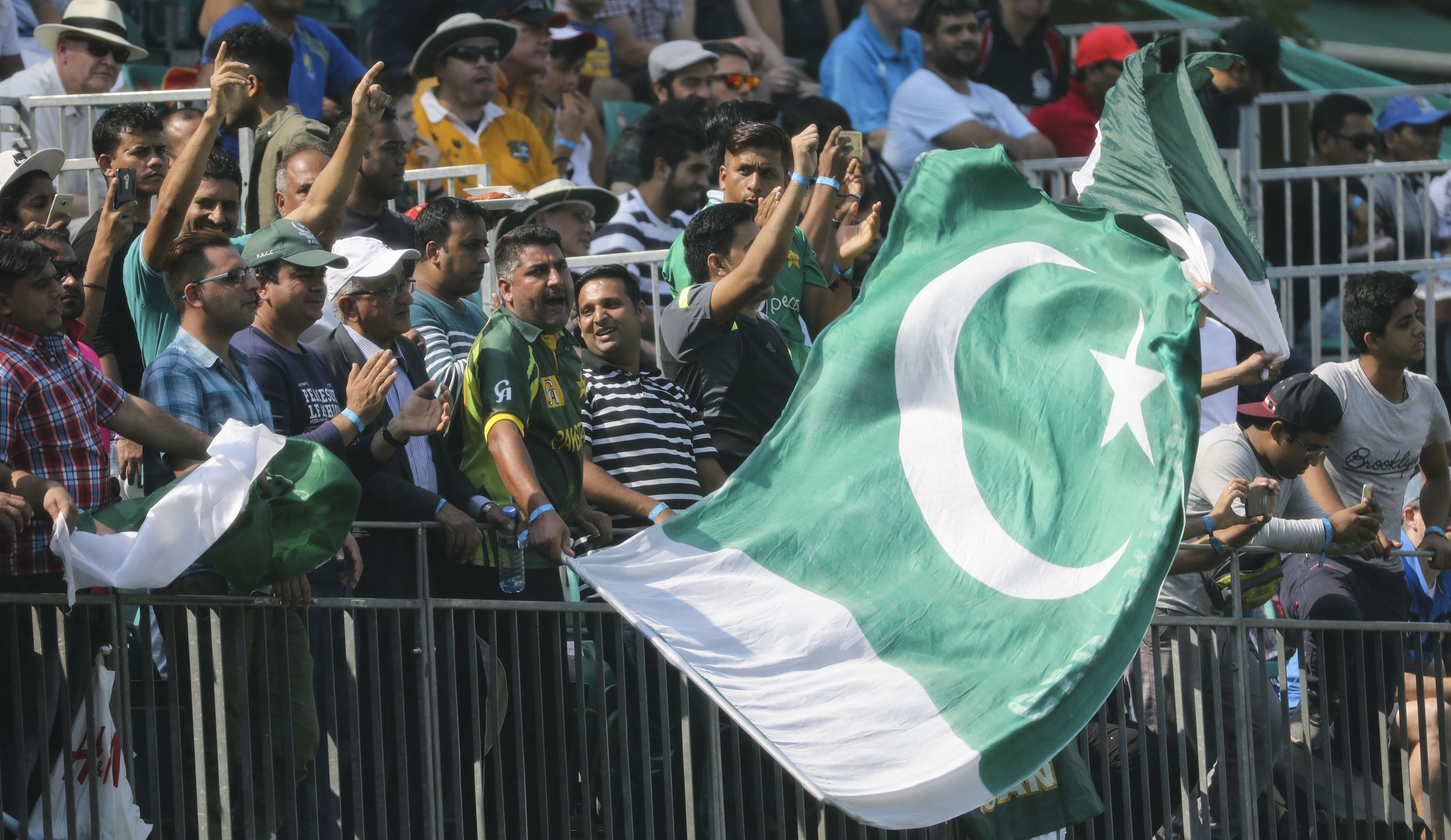 Pakistan fans cheer on their team during the first day of the Hong Kong World Sixes at Kowloon Cricket Club. Photo: Edward Wong