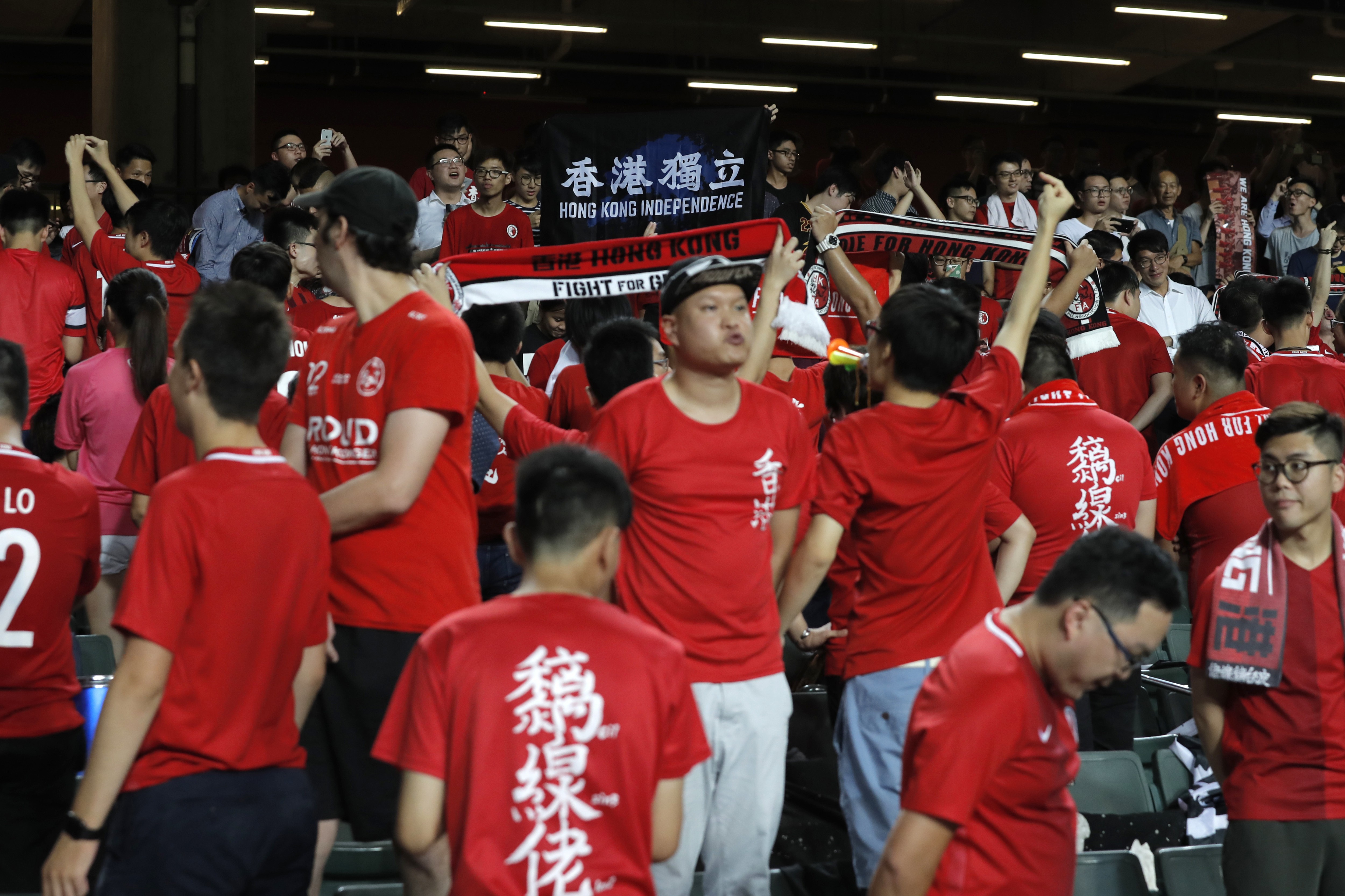 Fans of the home team boo the national anthem and display pro-independence banners during their AFC Asian Cup 2019 qualifying soccer match against Malaysia, in Hong Kong on October 10. Photo: AP