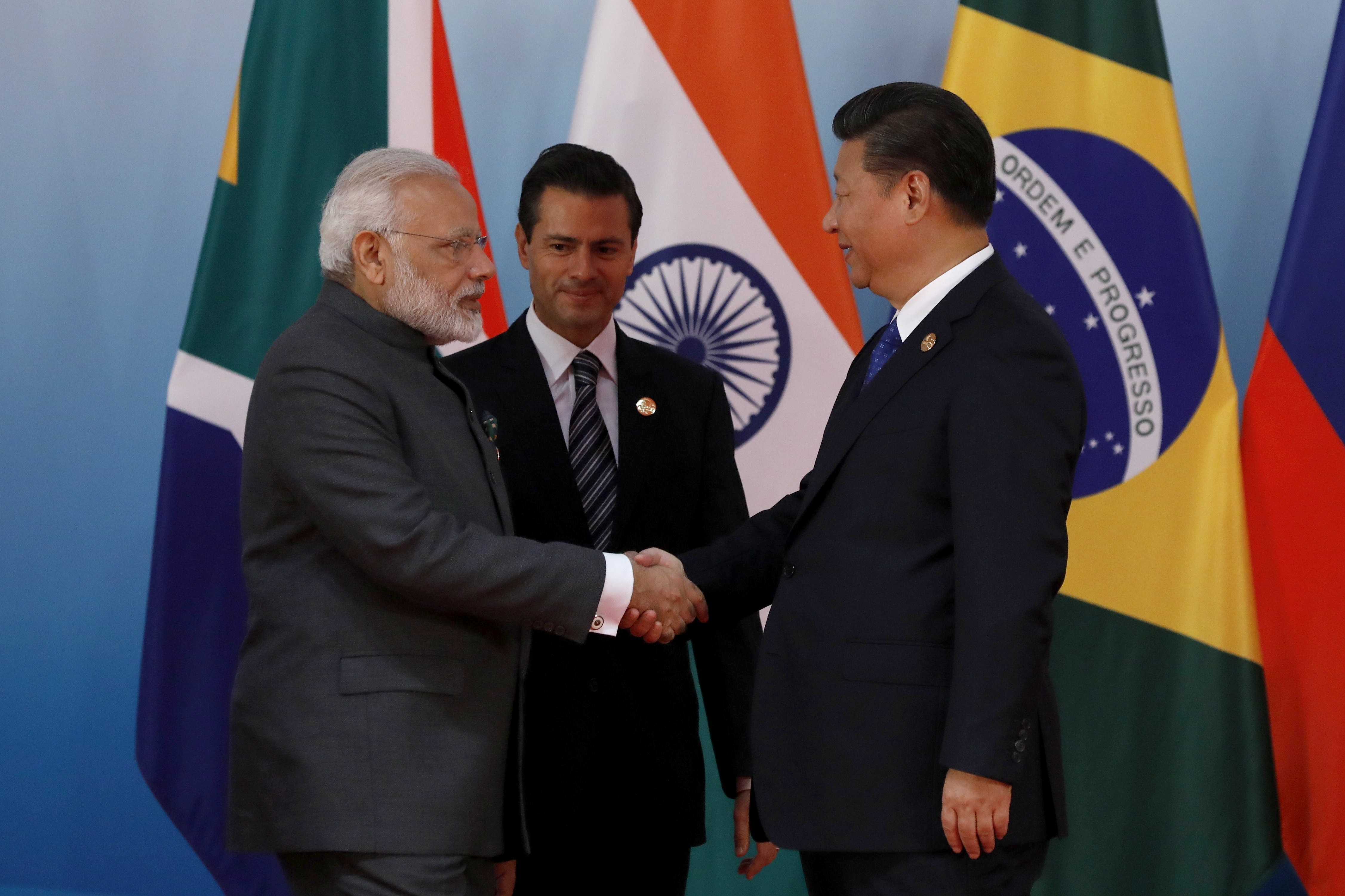 Indian Prime Minister Narendra Modi (left) greets Chinese President Xi Jinping while Mexican President Enrique Pena Nieto looks on, during the 2017 BRICS Summit in Xiamen, China, on September 5. Photo: EPA-EFE