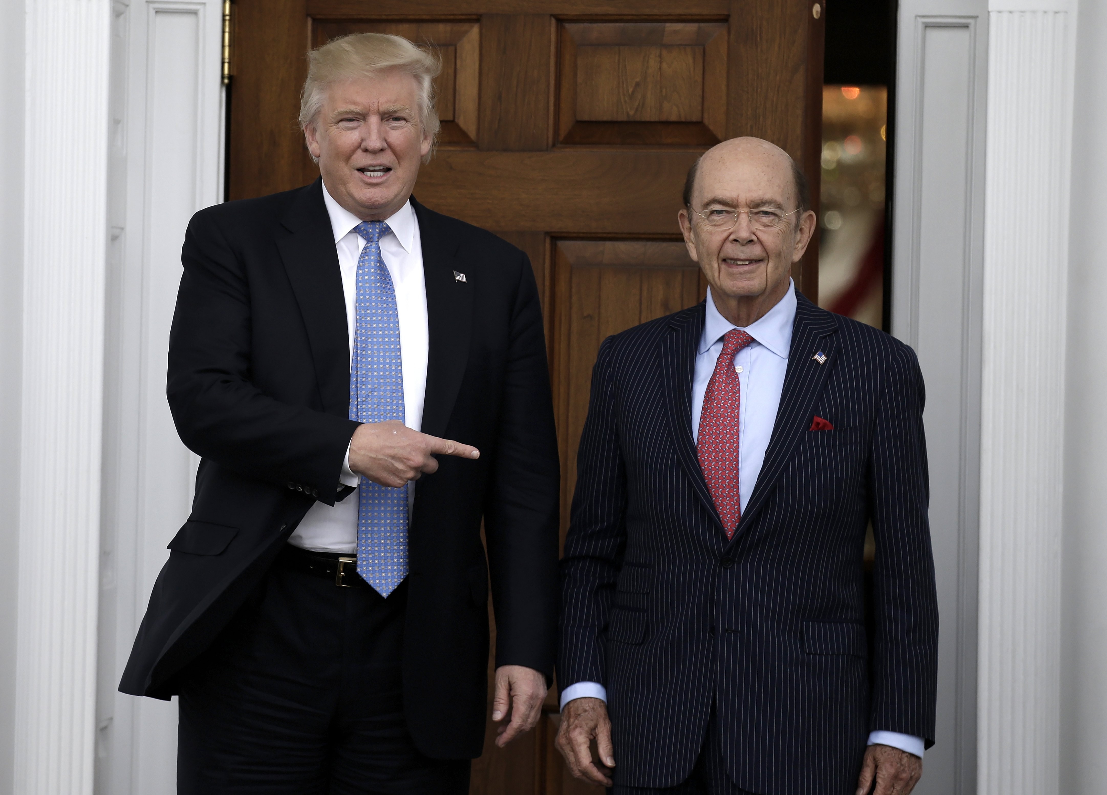 Donald Trump and Wilbur Ross who is now the US president’s commerce chief. File photo: EPA