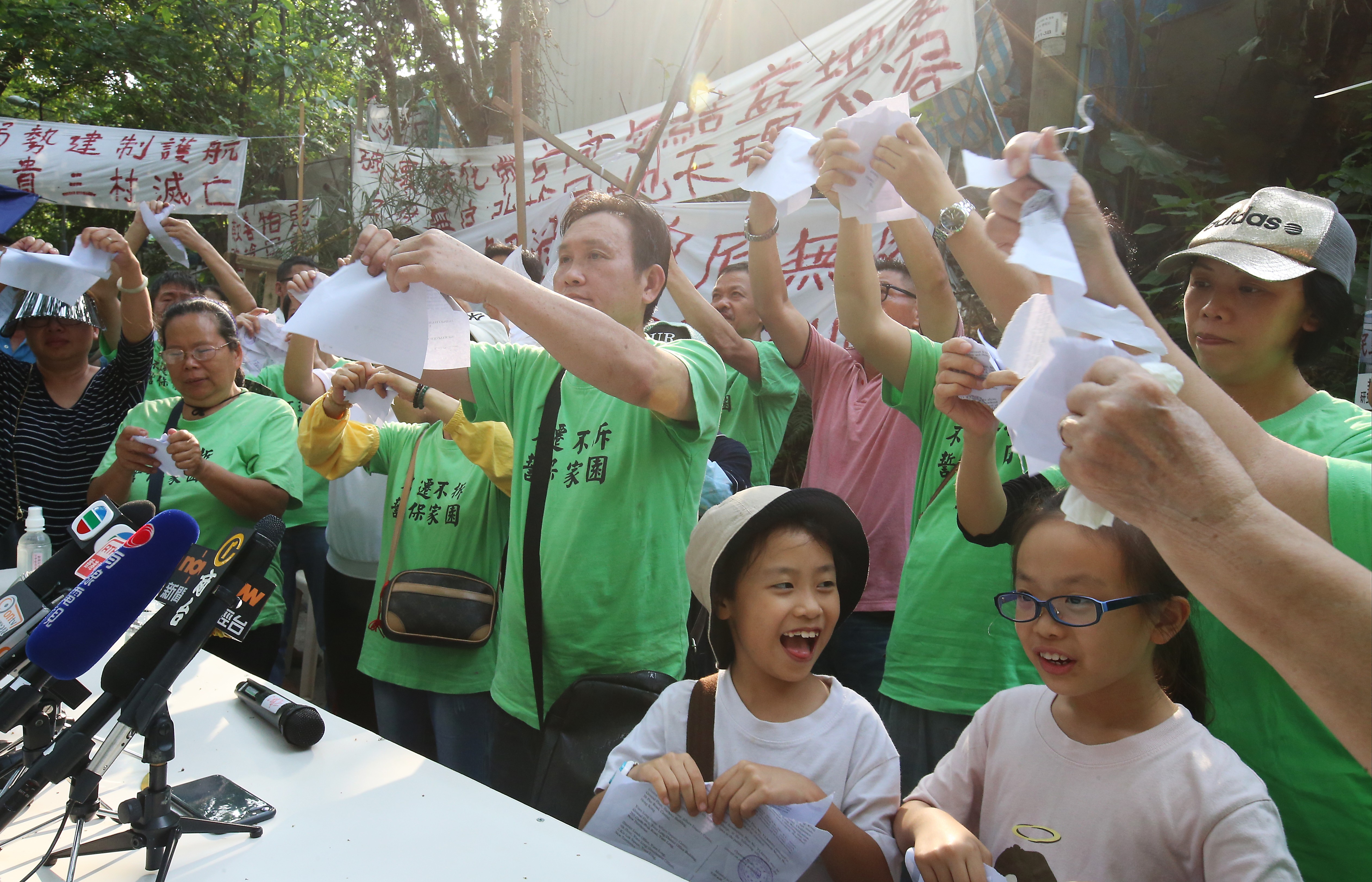 Residents from Wang Chau meet the media at a demonstration against the housing project. Photo: David Wong
