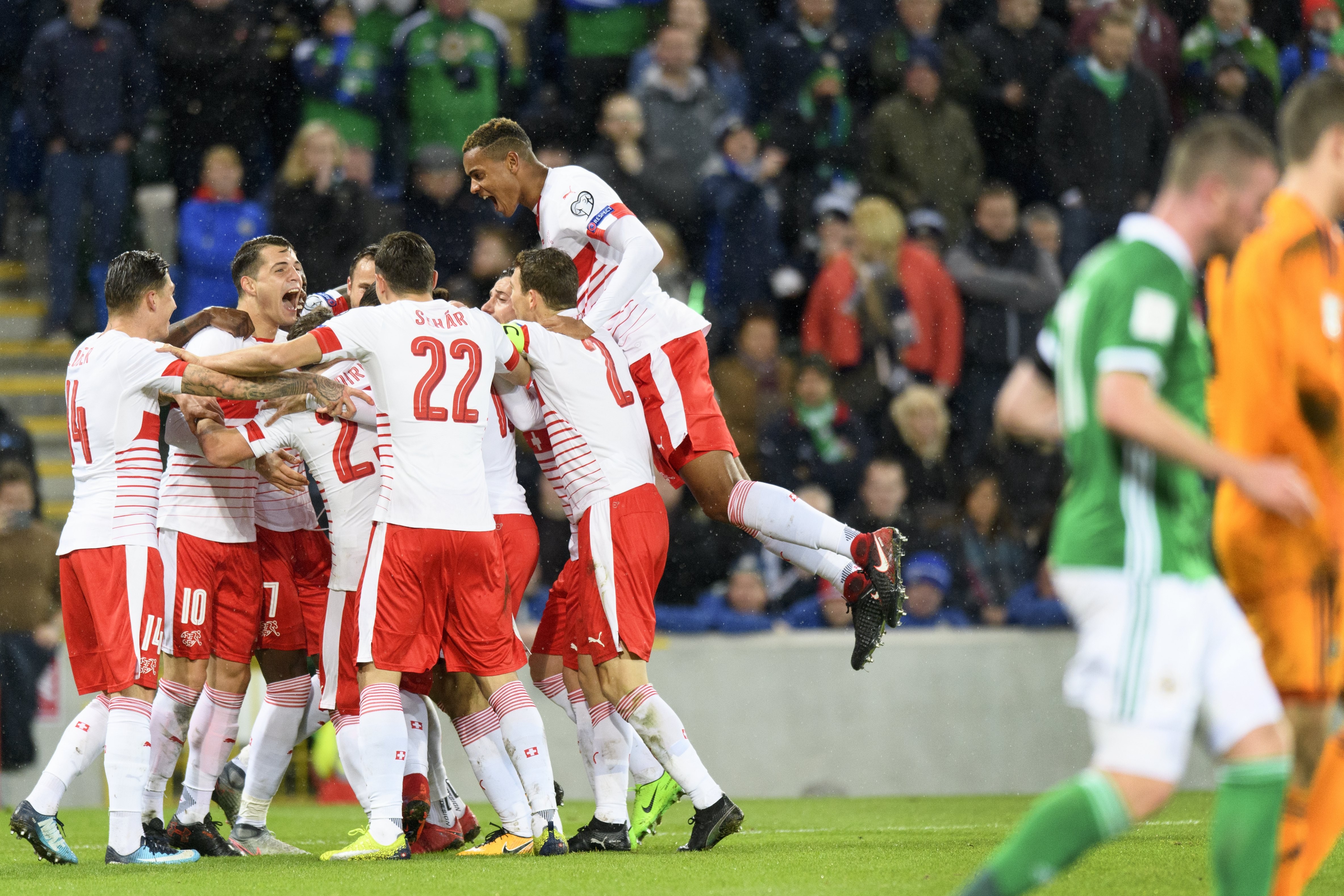 Switzerland players celebrate their 1-0 win over Northern Ireland. Photo: EPA