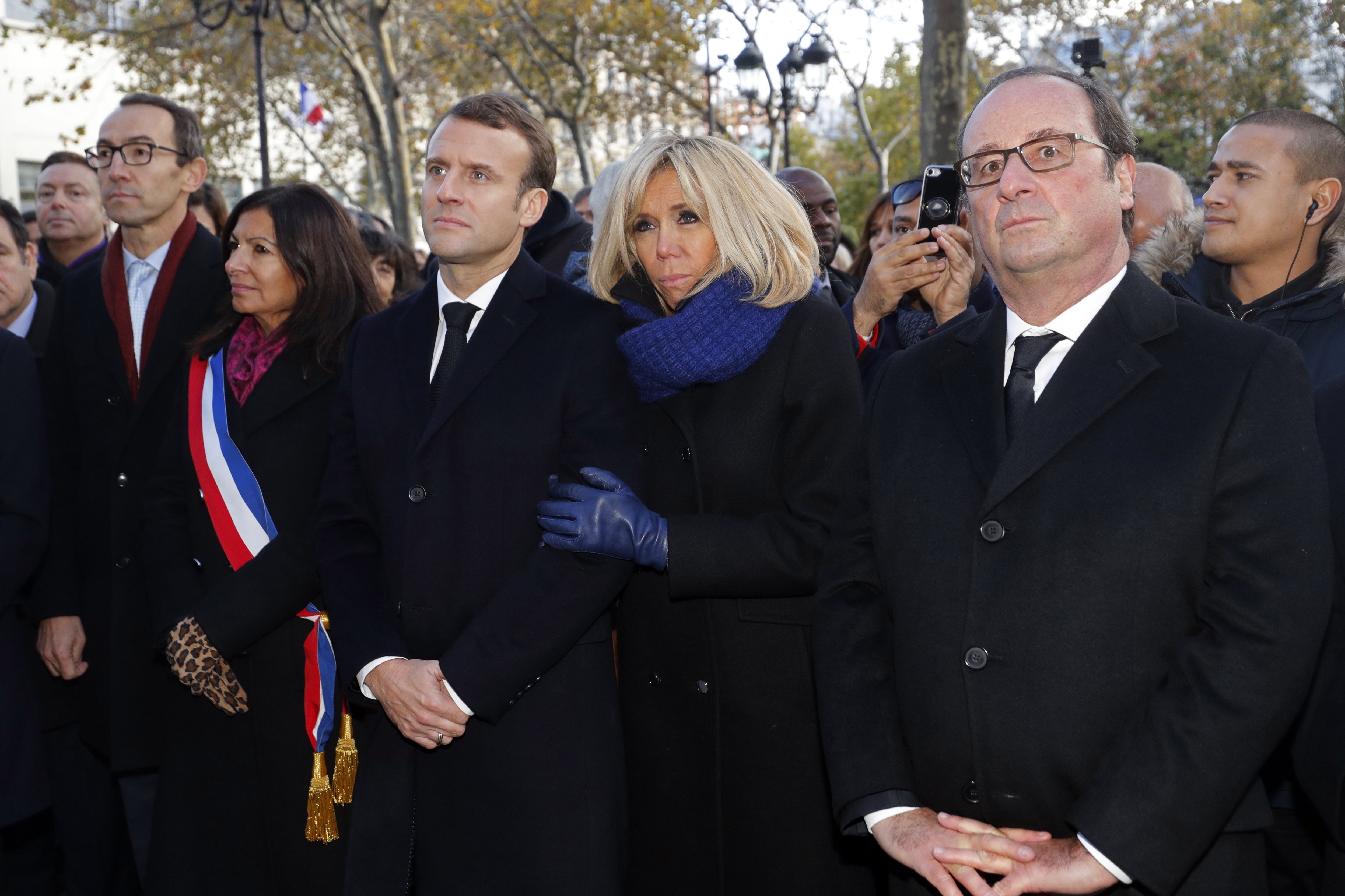 French President Emmanuel Macron, his wife Brigitte Macron, and former French president Francois Hollande. Photo: EPA