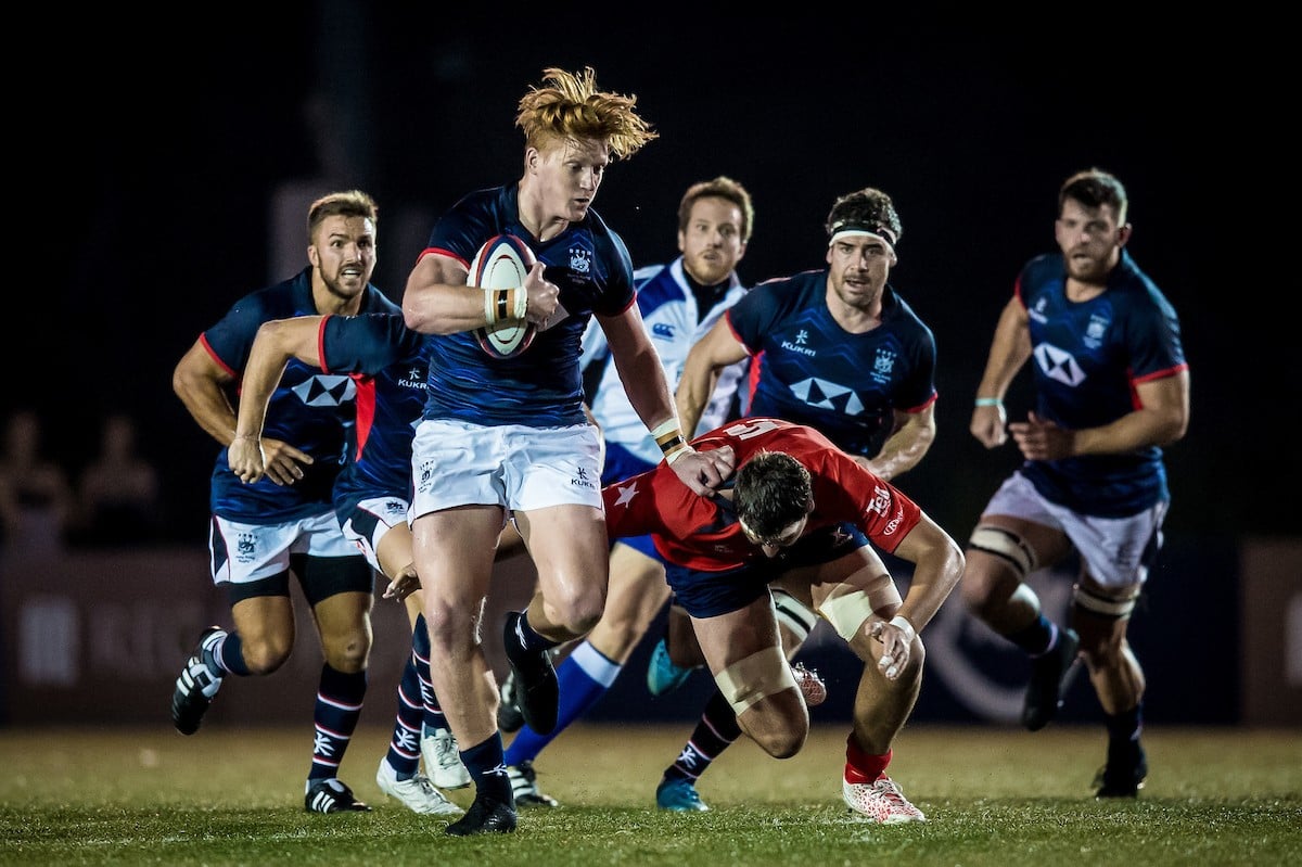Hong Kong's Sam Purvis attempts to bust open the Chile defence. Photos: HKRU