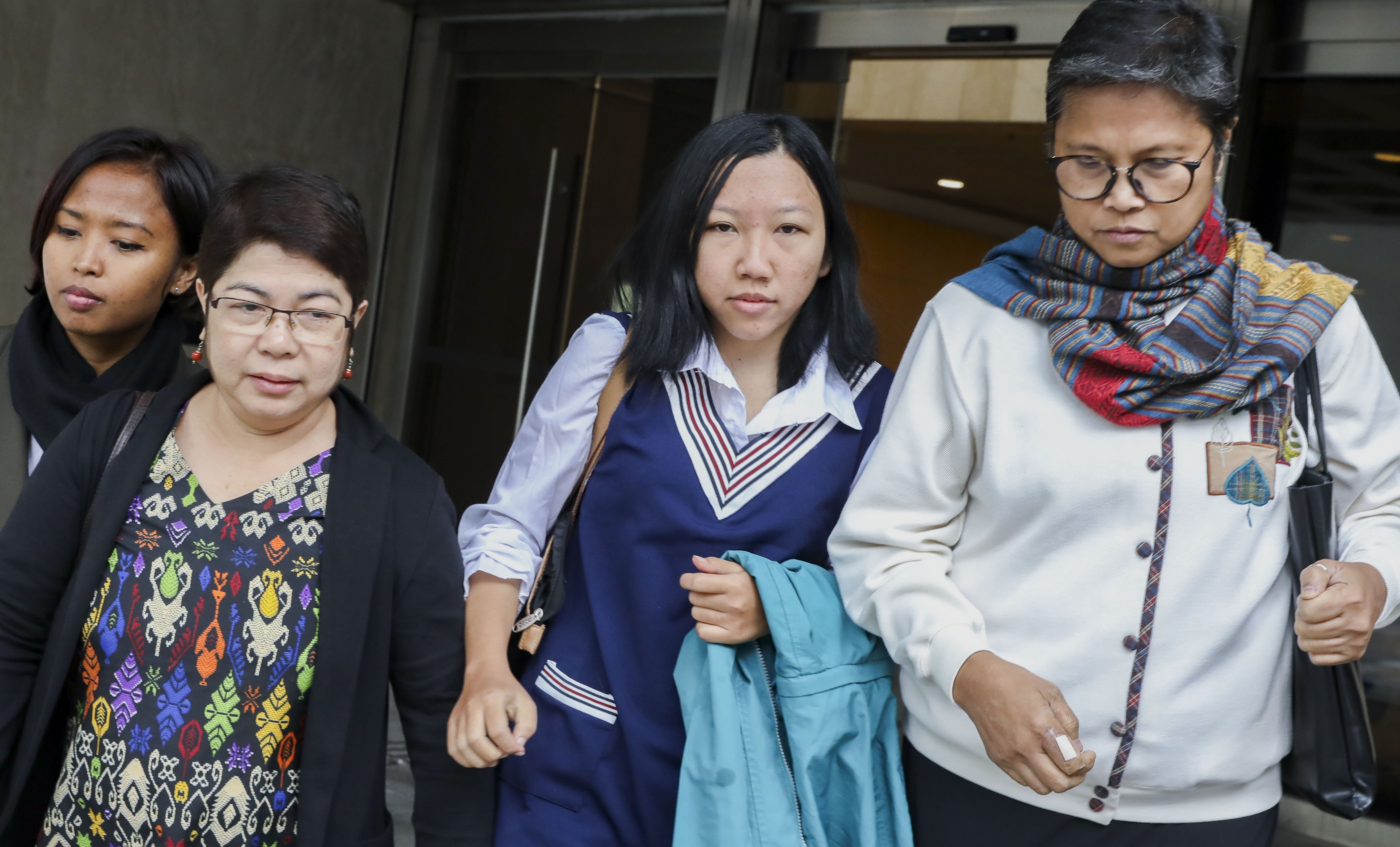 Former domestic helper Erwiana Sulistyaningsih (centre) appears at the High Court in Admiralty. Photo: Sam Tsang
