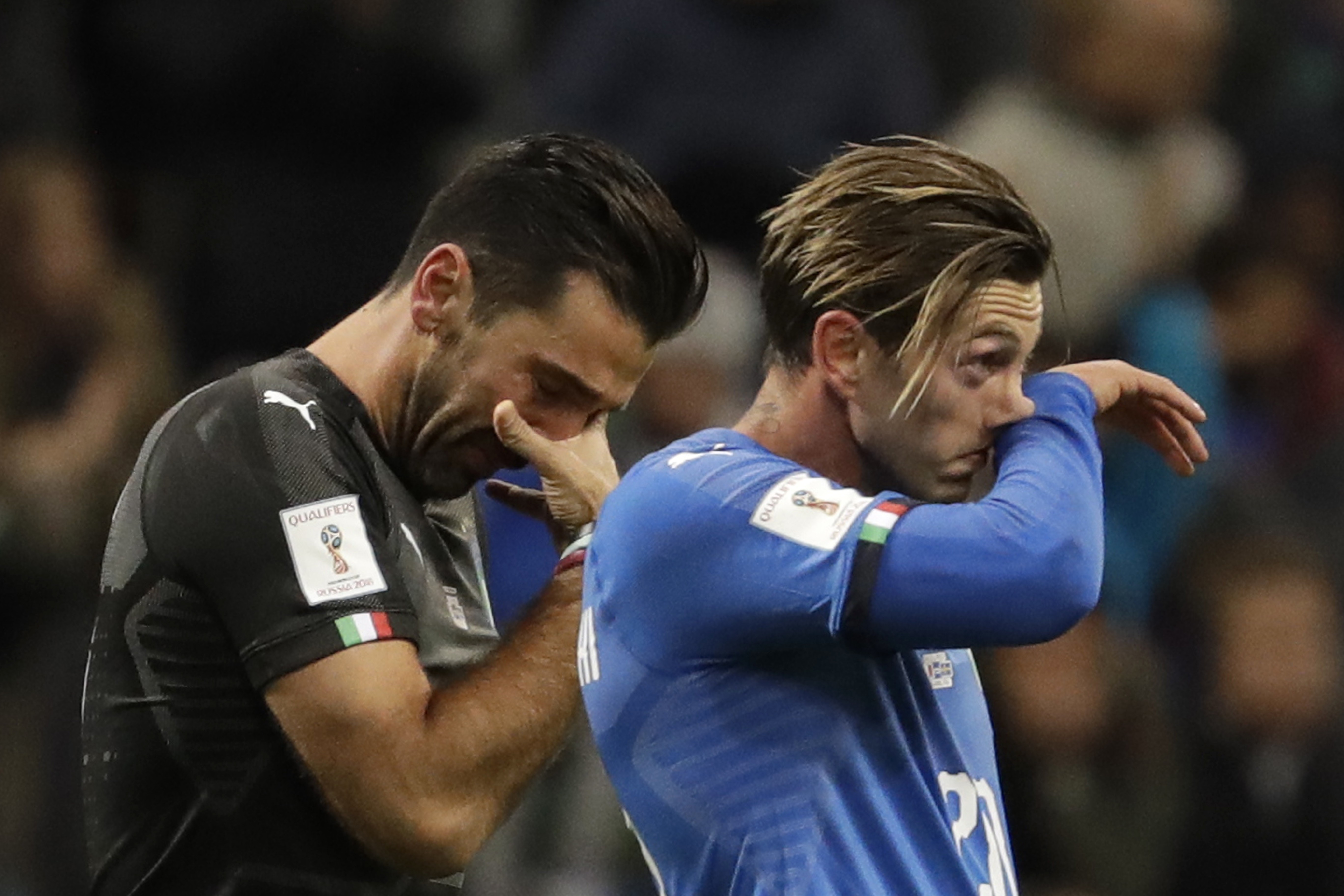 Italy’s legendary goalkeeper Gianluigi Buffon (left) was in tears after Italy’s play-off elimination and announced his retirement from international football. Photo: AP