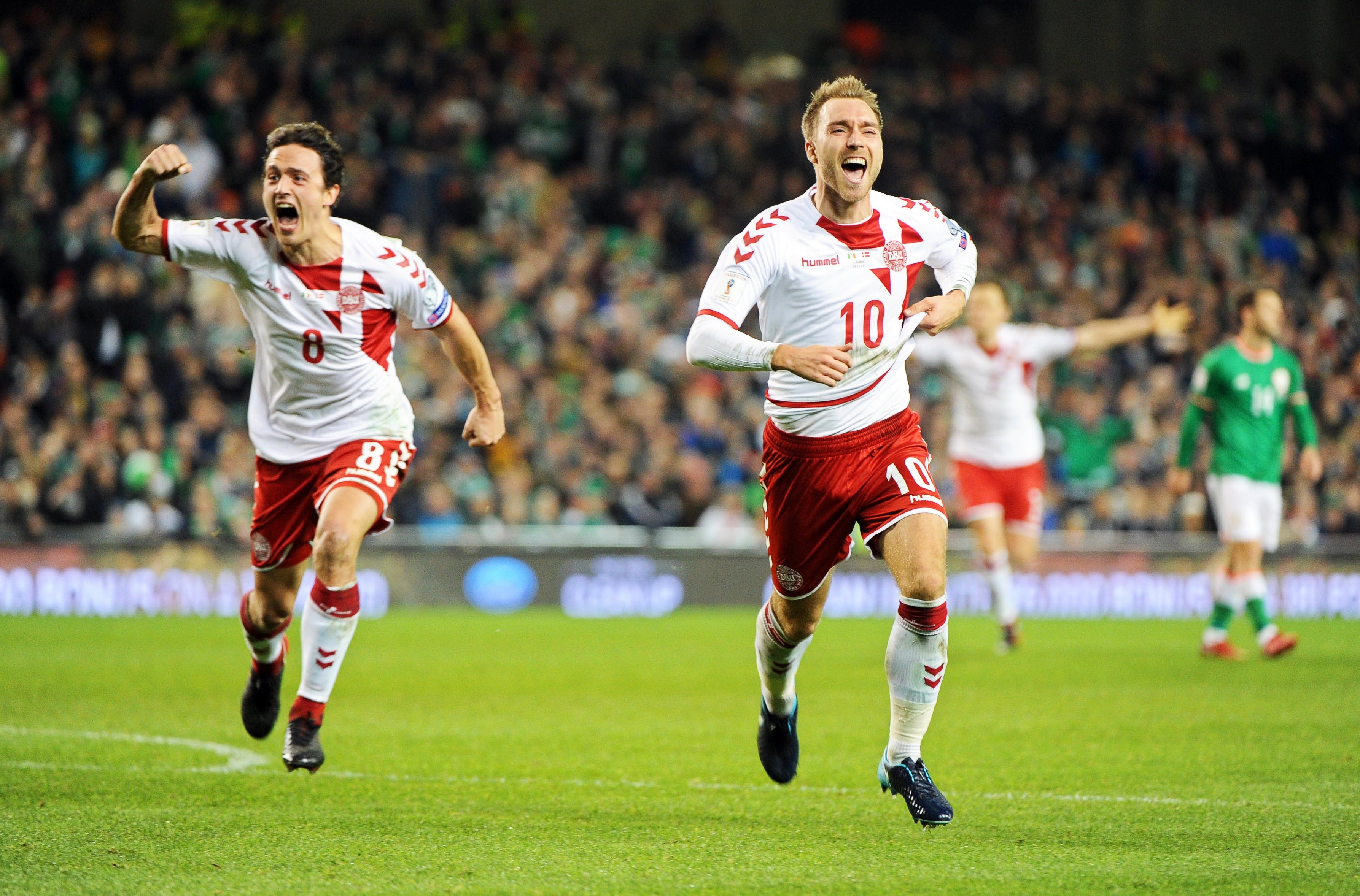 Christian Eriksen (right) celebrates after against Ireland. Photo: EPA