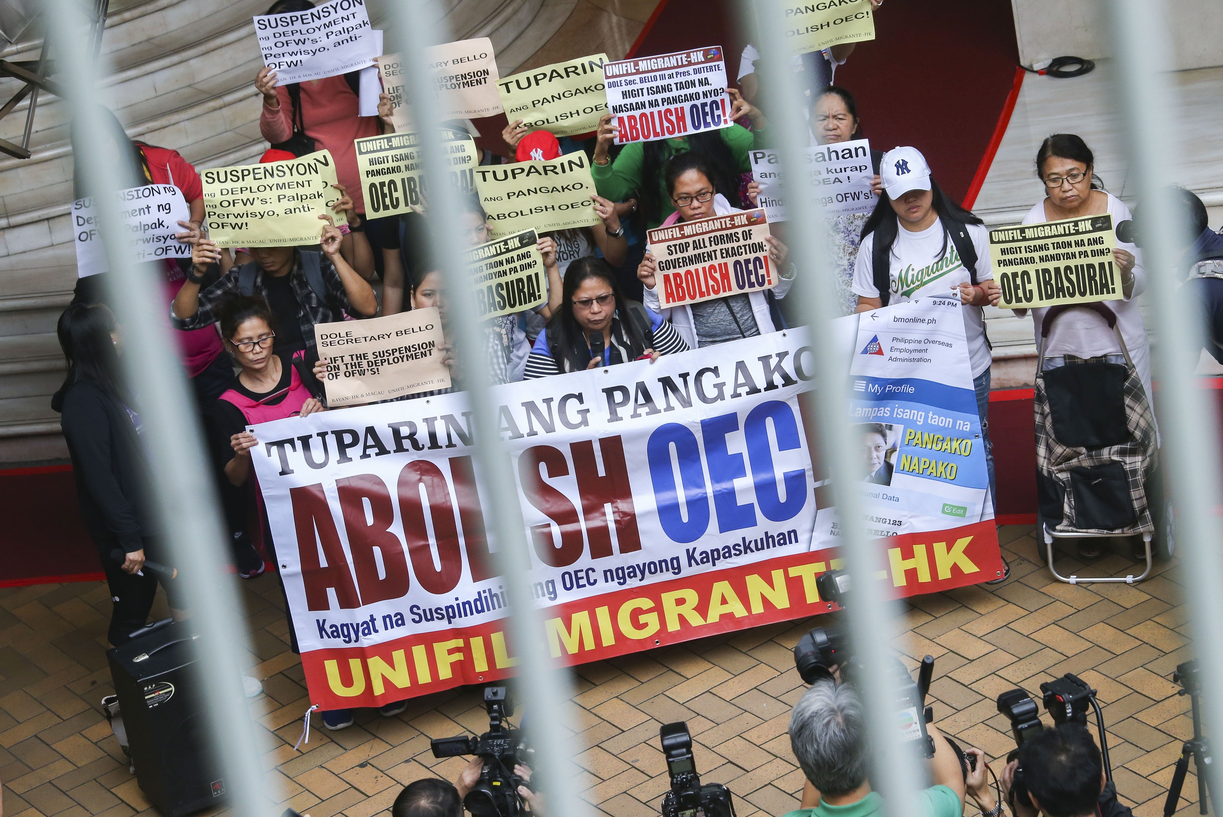 Filipinos in Hong Kong hold a short protest outside the United Centre Building in Admiralty. Photo: David Wong