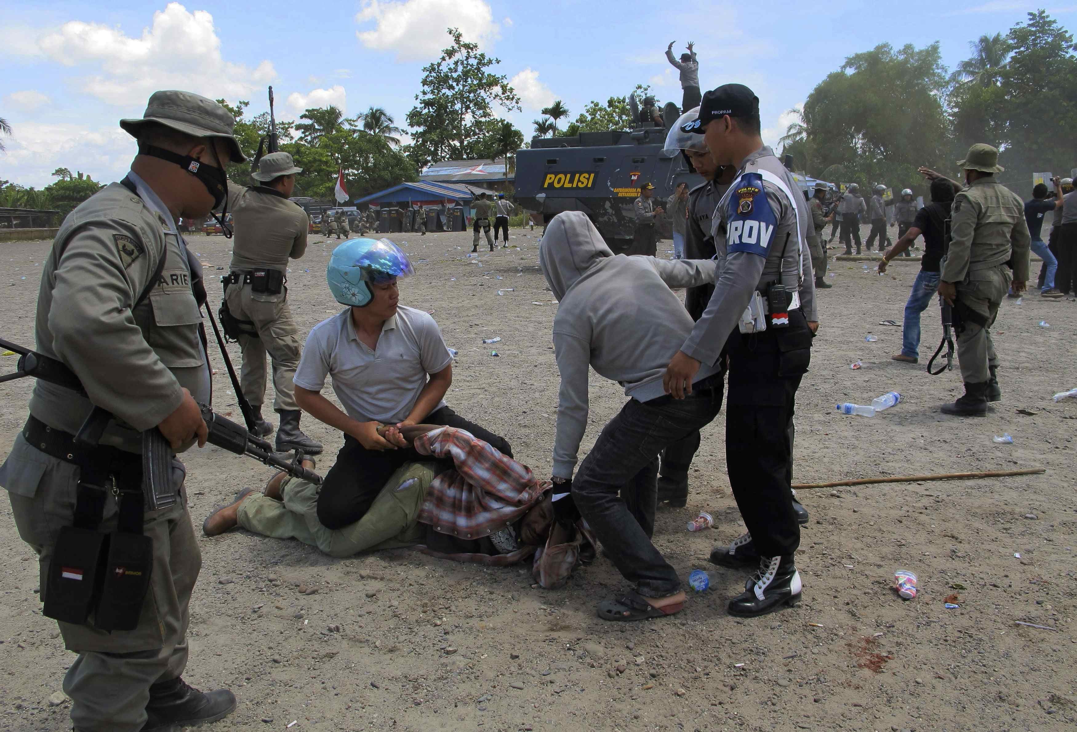 Police arrest a man in Timika after dispersing hundreds of West Papuans attending a ceremony to commemorate the 50th anniversary of West Papua’s independence from Dutch rule. Photo: Reuters