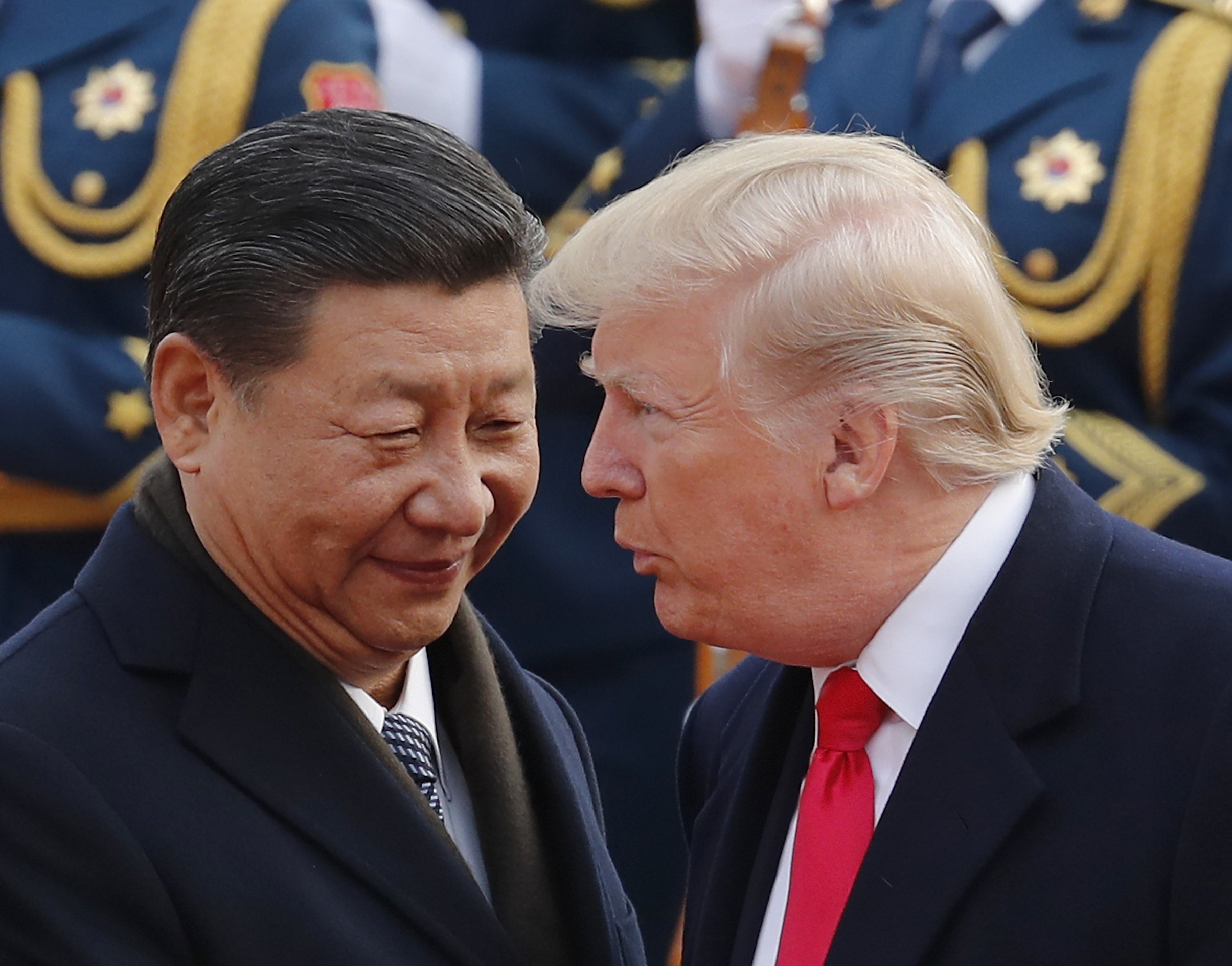 Chinese President Xi Jinping chats to US President Donald Trump during a welcoming ceremony at the Great Hall of the People in Beijing, on November 9. Photo: AP
