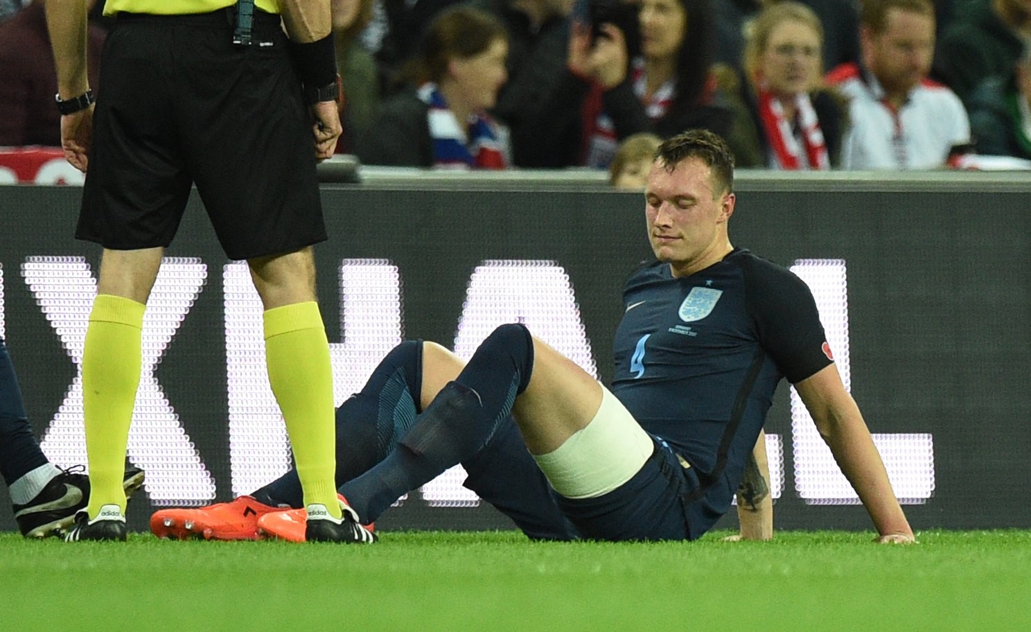 Phil Jones sits on the turf after suffering another injury. Photo: EPA