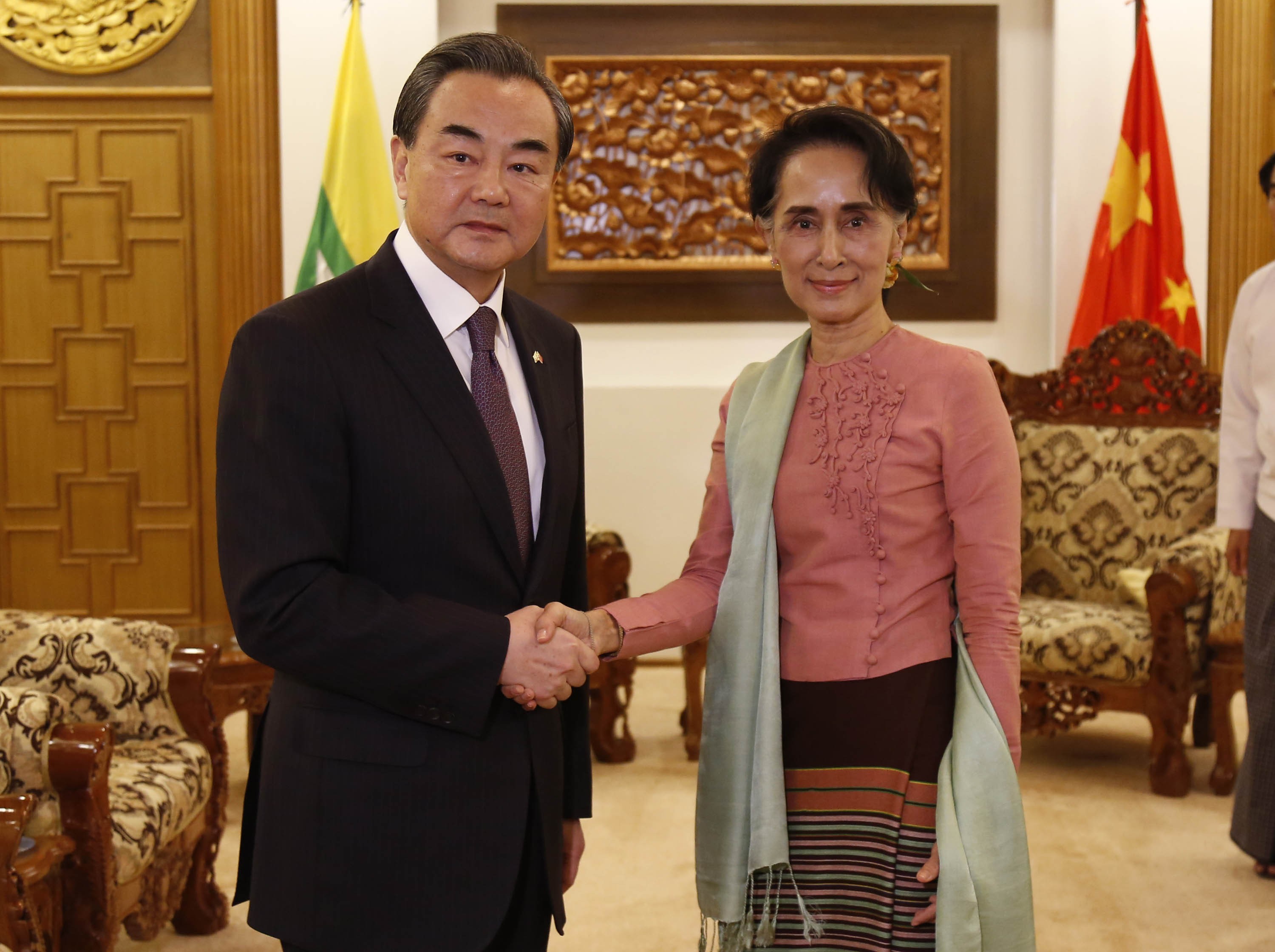 Chinese Foreign Minister Wang Yi shakes hands with Myanmar's Aung San Suu Kyi in Naypyidaw, Myanmar, in April 2016. Photo: Xinhua
