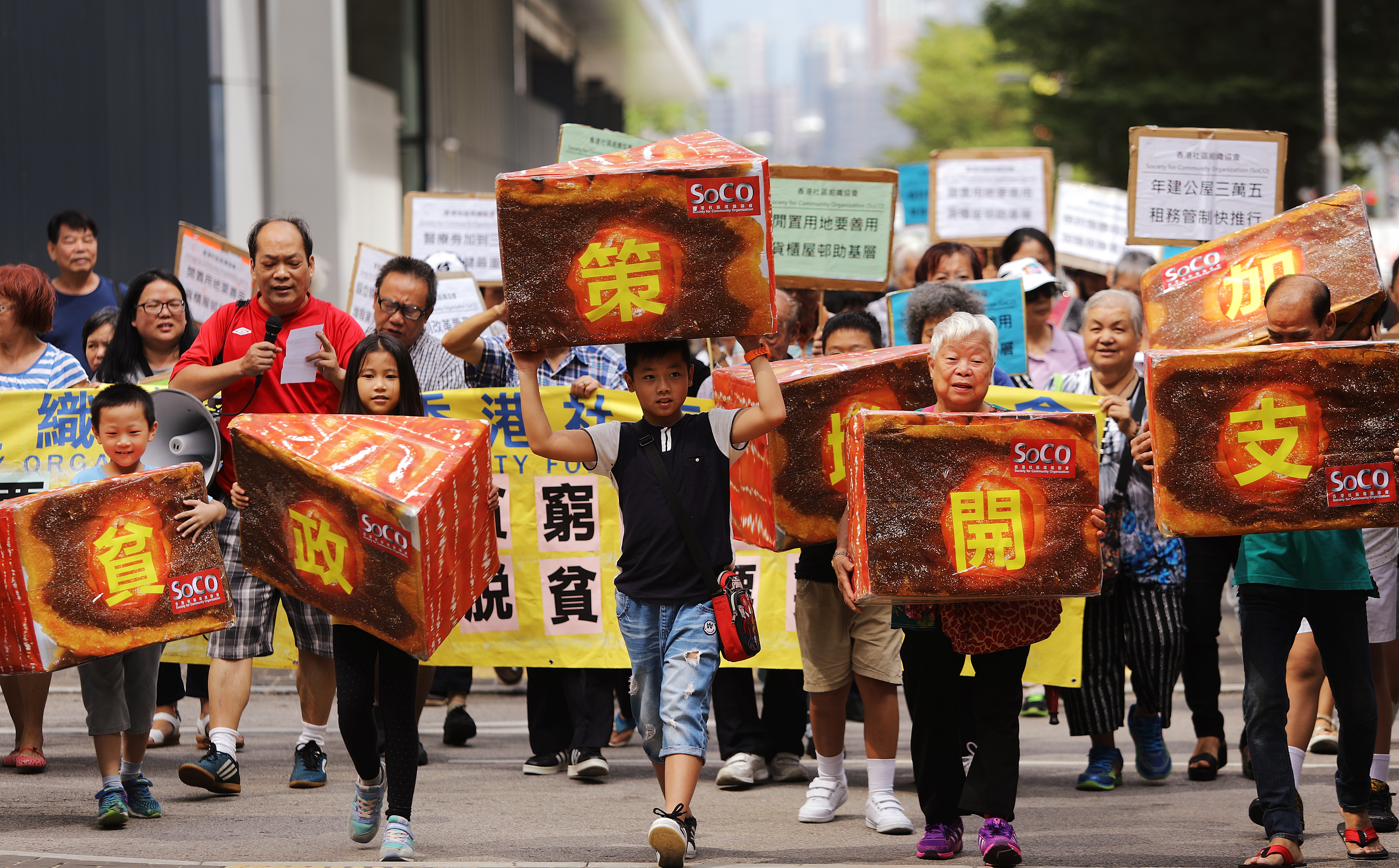 Members of the Society for Community Organisation march to the government headquarters to demand more poverty reduction measures in the Hong Kong chief executive’s policy address, on October 5. The 2017 policy address, delivered on October 11, pledged more resources for poverty alleviation and the disadvantaged. Photo: Sam Tsang