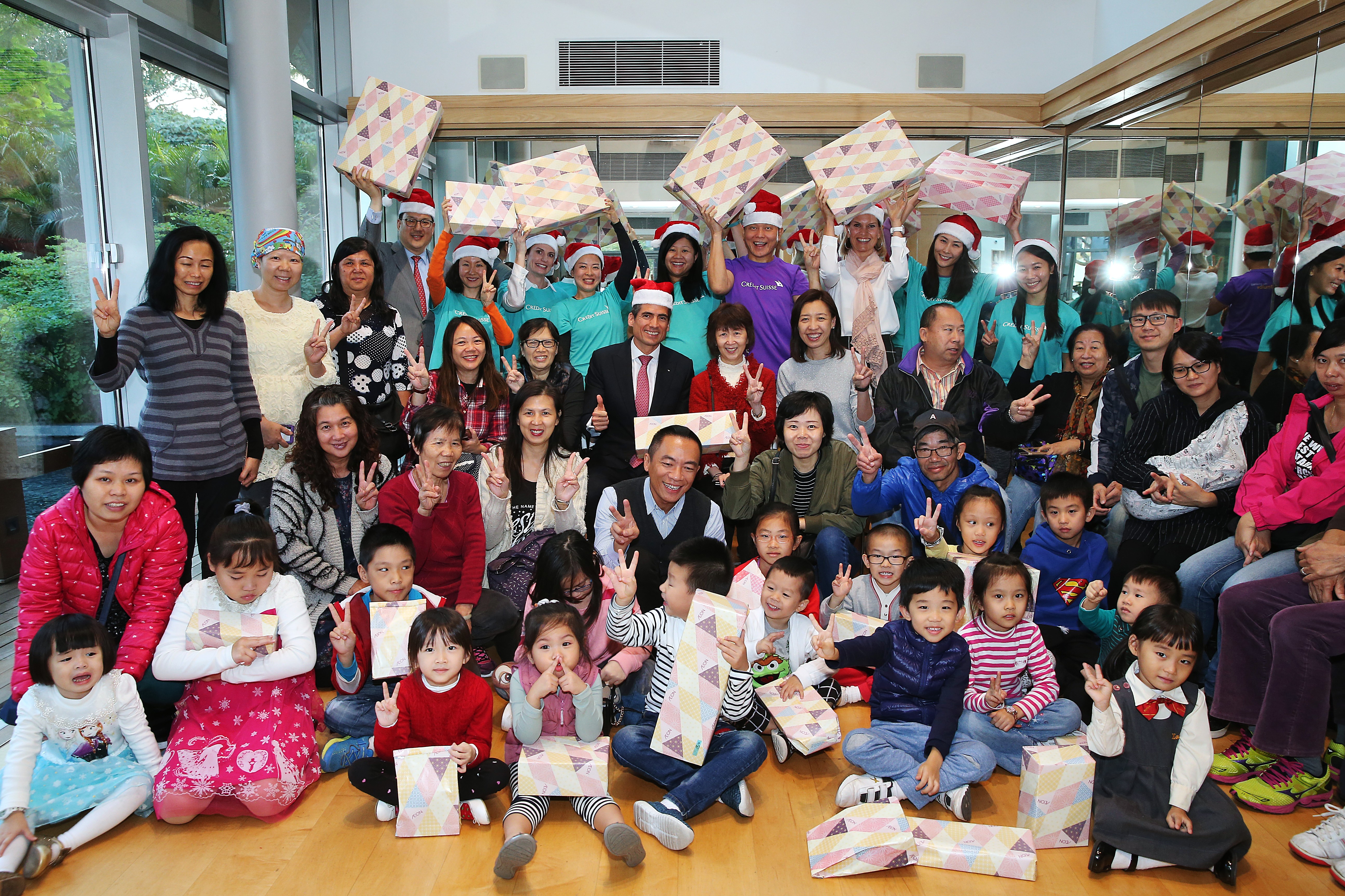 Financial services firm Credit Suisse hosts party at support facility in Tuen Mun, with their managing director riding in as Santa Claus