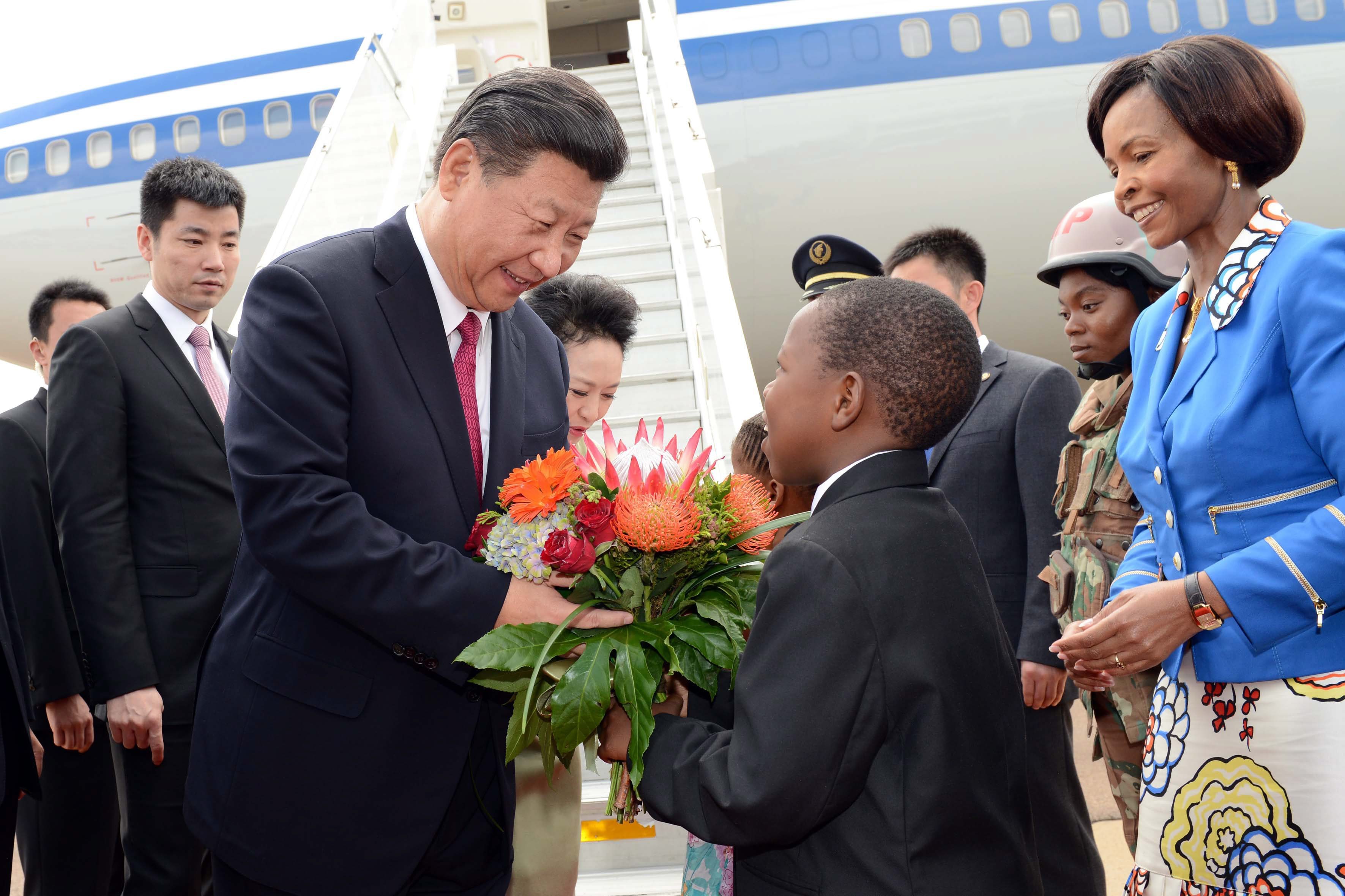 Chinese President Xi Jinping is greeted upon his arrival at Waterkloof Air Force Base in Pretoria, South Africa, in December 2015. Photo: EPA