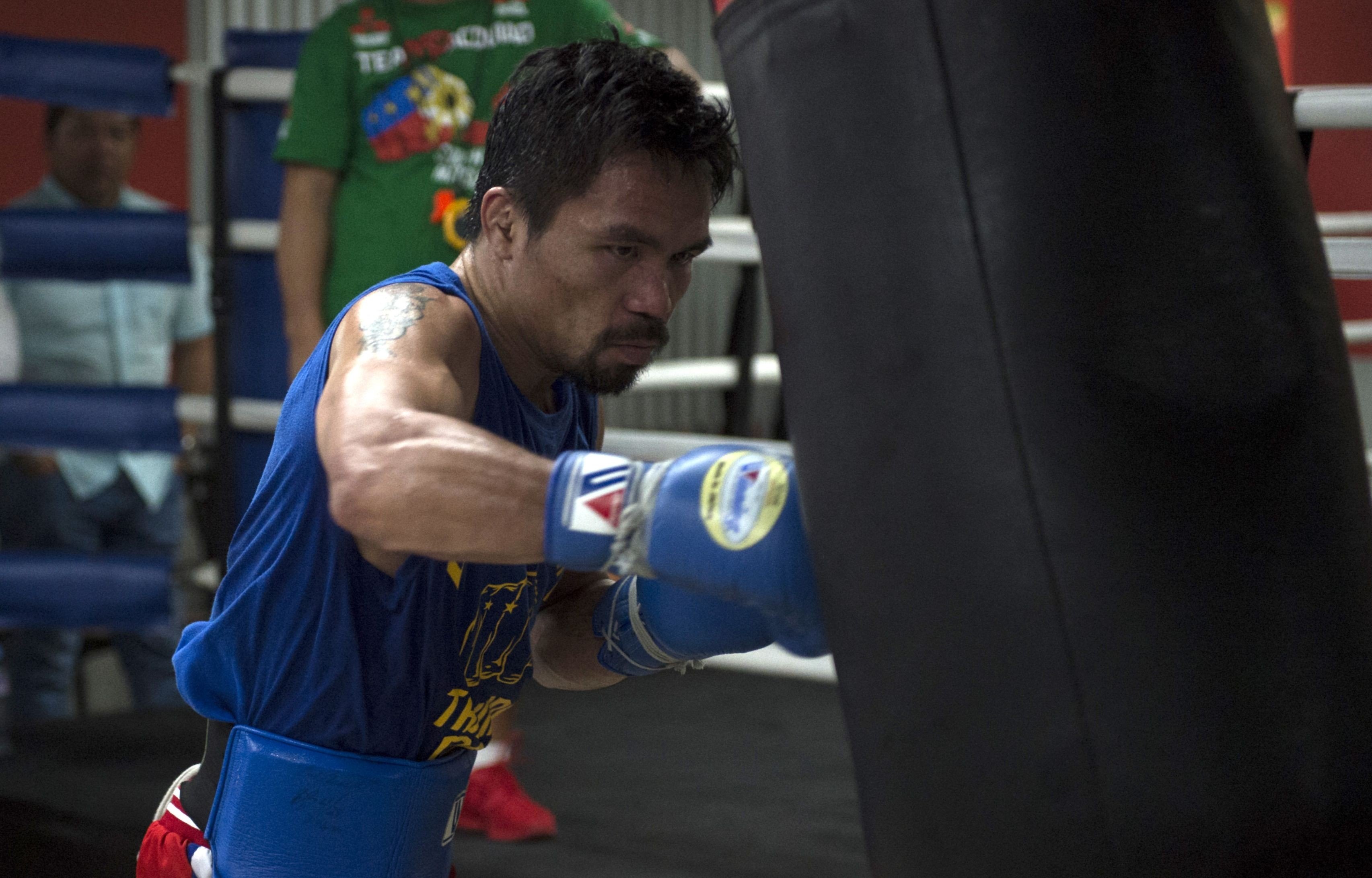 Philippine boxer Manny Pacquiao training at a gym in Manila. The boxer and senator is opening an academy in Beijing. Photo: AFP