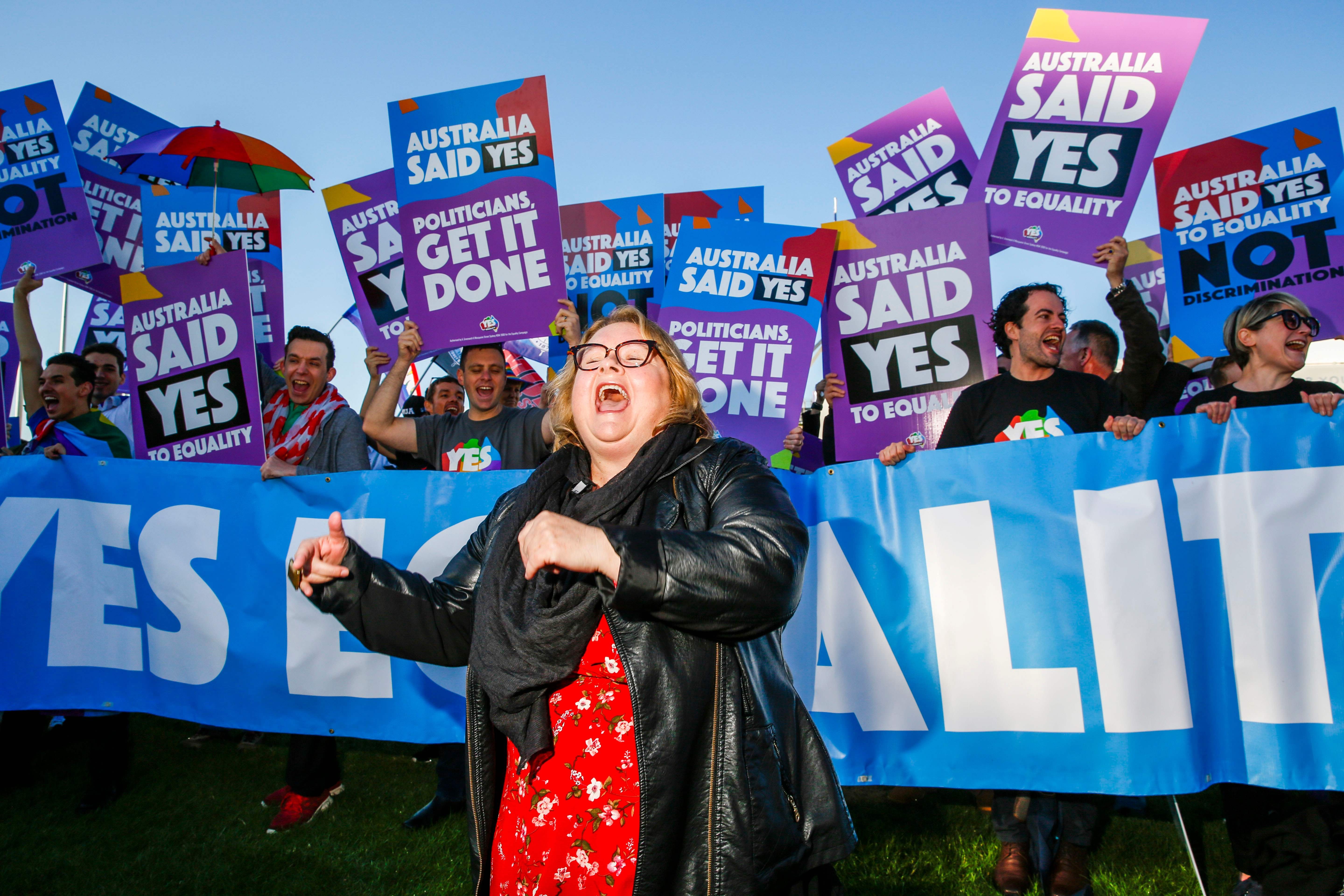 Supporters of same-sex marriage celebrate in front of Parliament House in Canberra. Photo: AFP