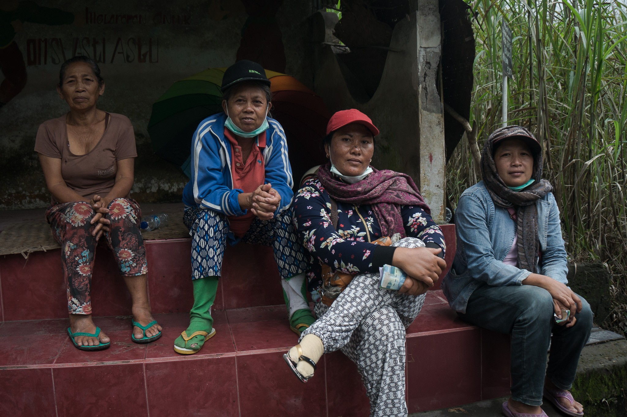 Ketut Suweni (second left) with colleagues after a day working in the gravel pit. Photo: Nathan Thompson