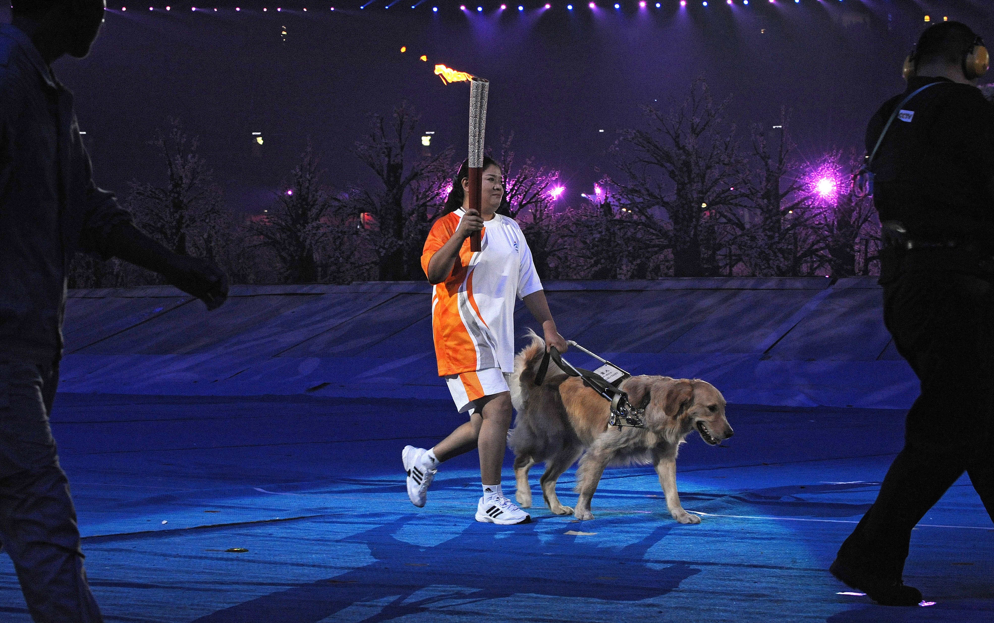 Ping Yali with her guide dog Lucky at the Beijing Olympics. Photo: AFP