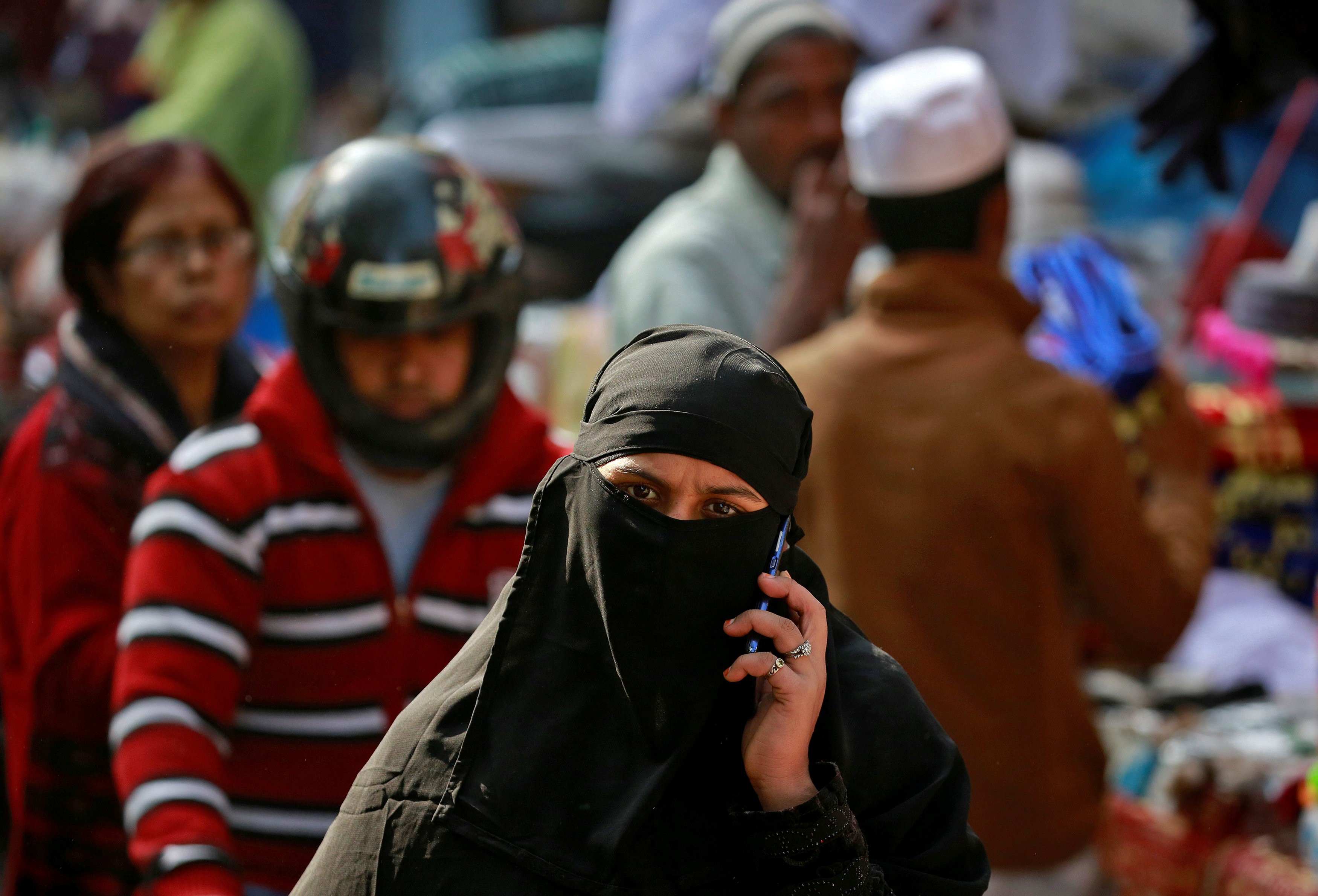A Muslim walks through a market in New Delhi, India. There has been a spate of recent hate crimes against Muslims in India. Photo: Reuters