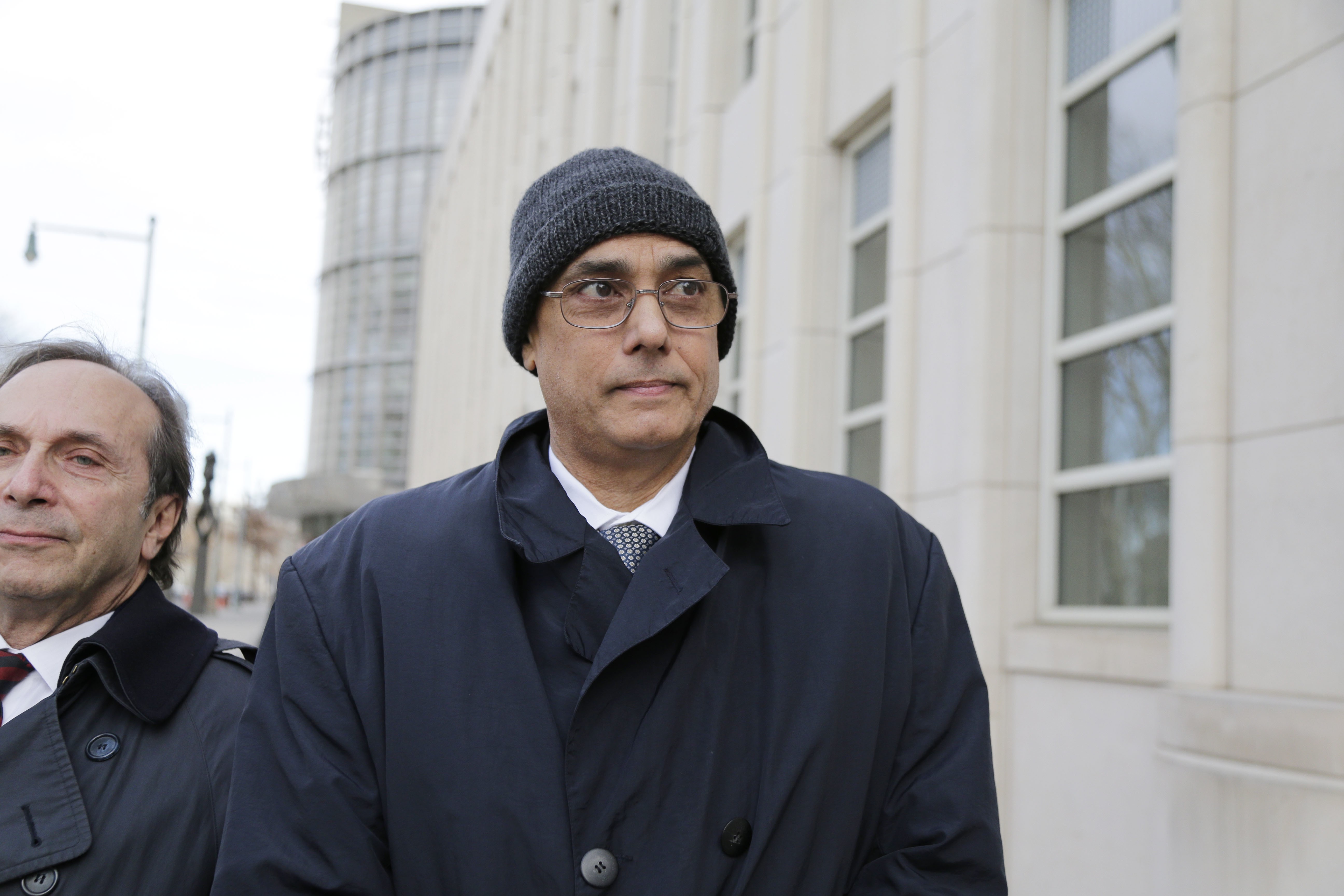 Manuel Burga leaves federal court in Brooklyn, New York, on Tuesday. The former South American soccer official, who was charged in a US trial stemming from the Fifa bribery scandal, was acquitted of a corruption charge. Two others were convicted in the case last week. Photo: AP