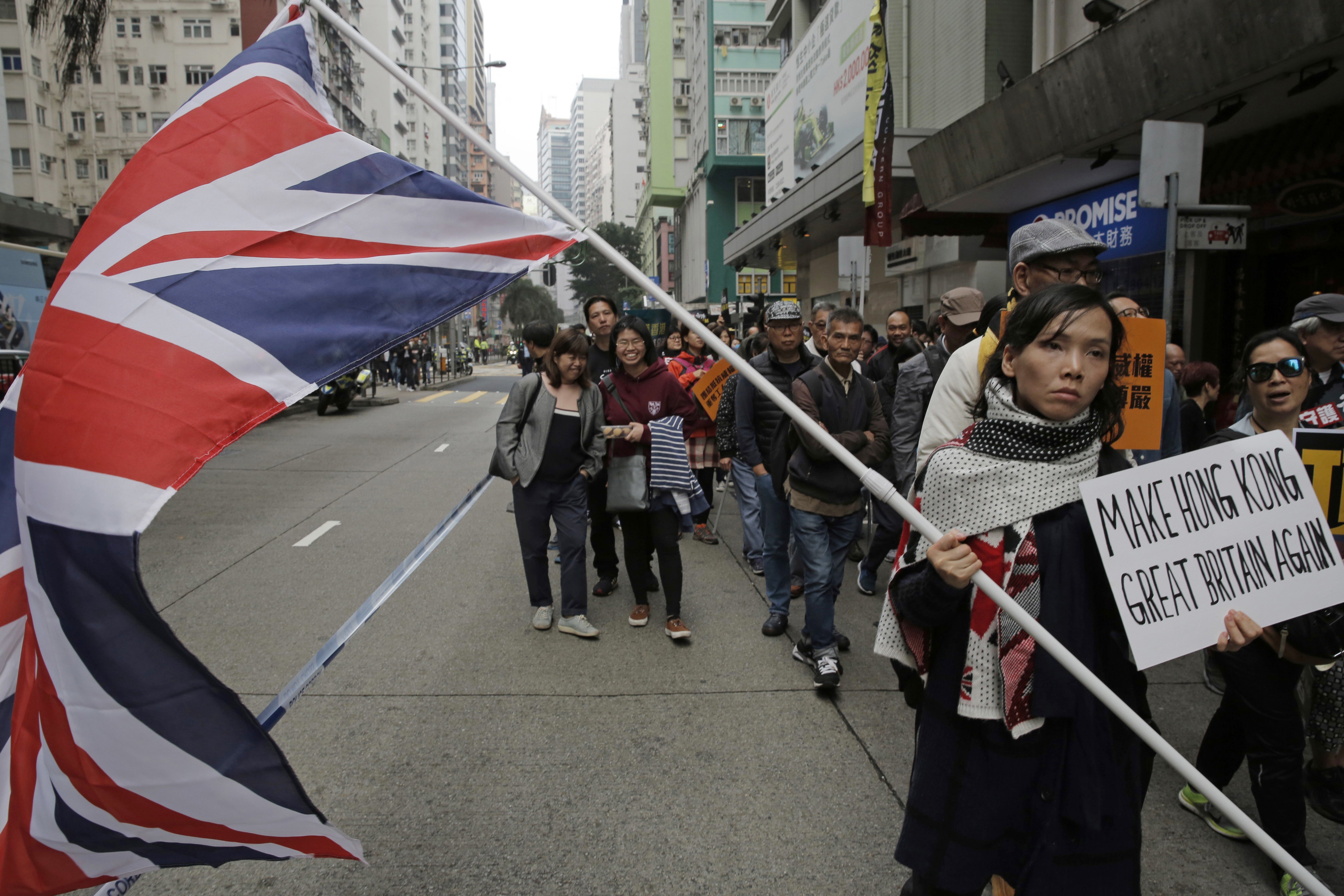 A protester at the New Year’s Day march in Hong Kong shows where her loyalties lie. Photo: AP