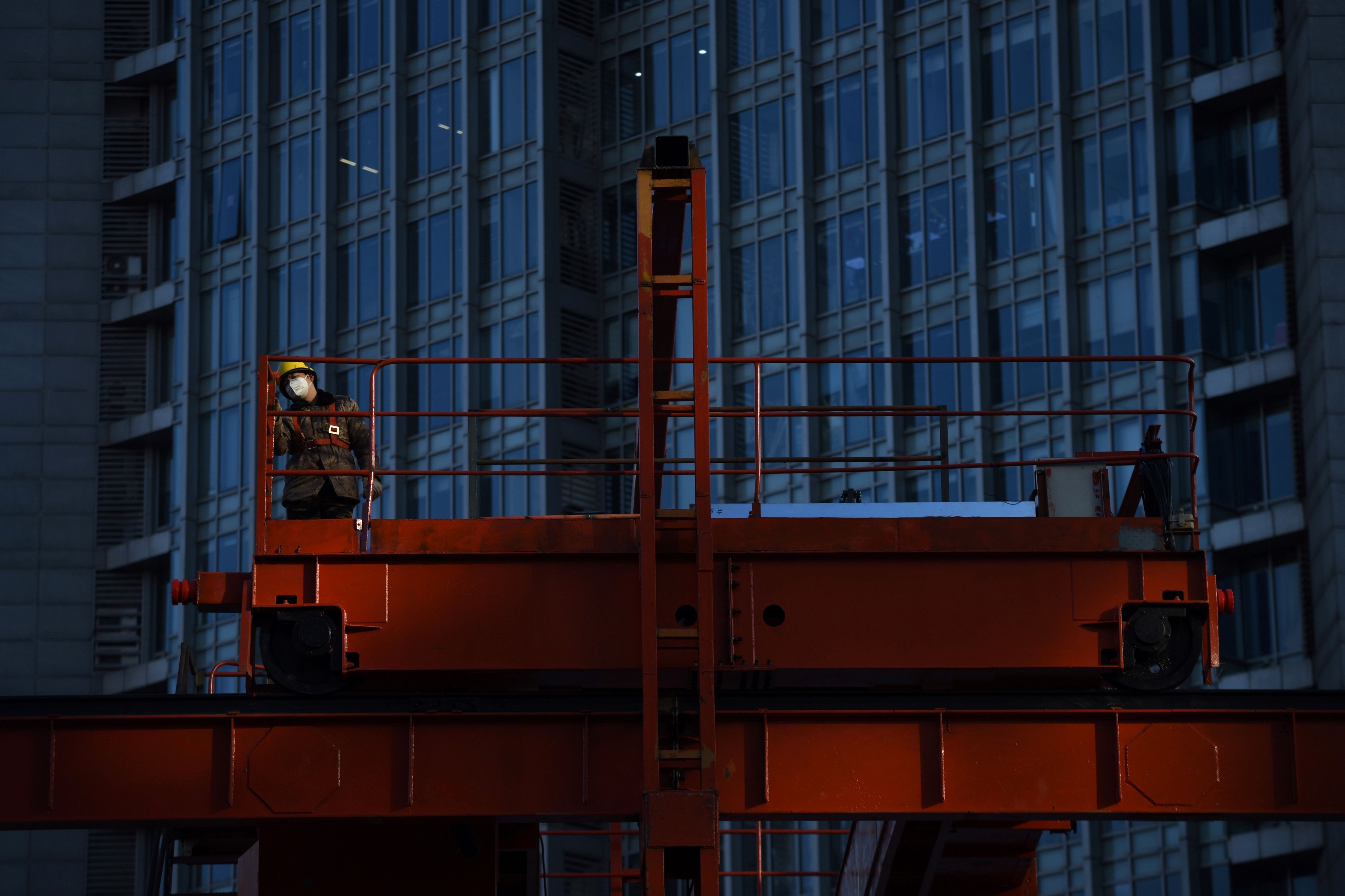A construction worker in Beijing. Though infrastructure investment in China has been increasing as a share of total investment since 2012, it has already reached such a high level that continued growth could worsen resource allocation. Photo: AFP