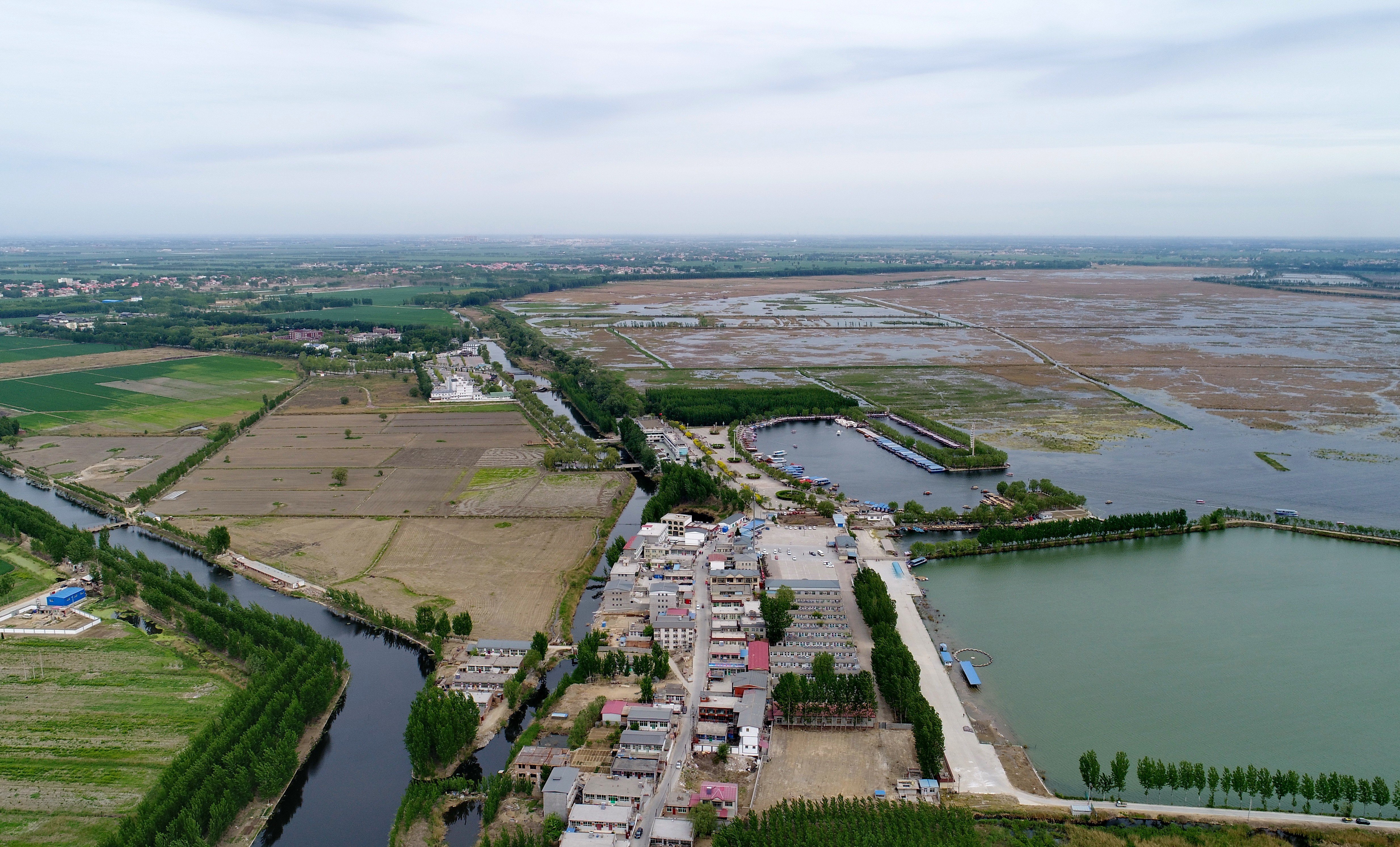 Aerial view of a village in Baiyangdian, one of the largest freshwater wetlands in the northern Chinese province of Hebei. The Xiongan New Area, officially announced on April 1, 2017, will span Xiongxian, Rongcheng and Anxin counties and will eventually cover 2,000 square kilometres. Photo: Xinhua