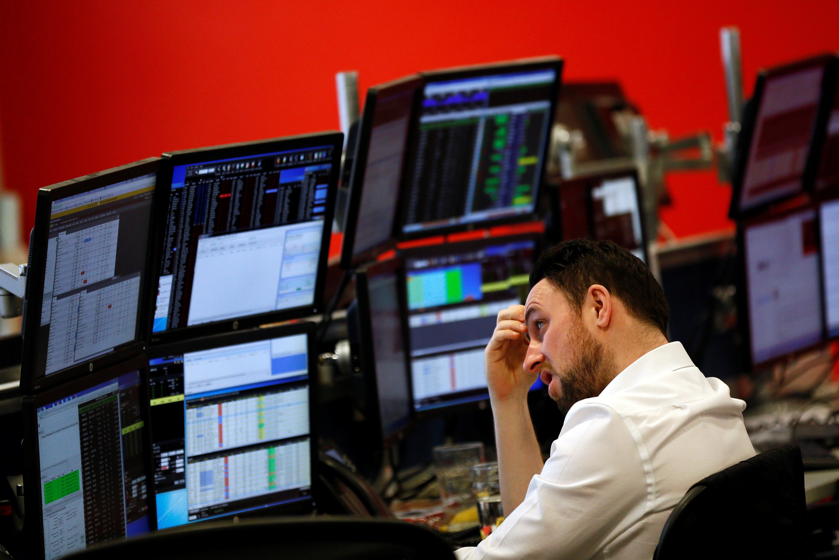 A market maker works on the trading floor at IG Index in London on January 14, 2016. Photo: REUTERS