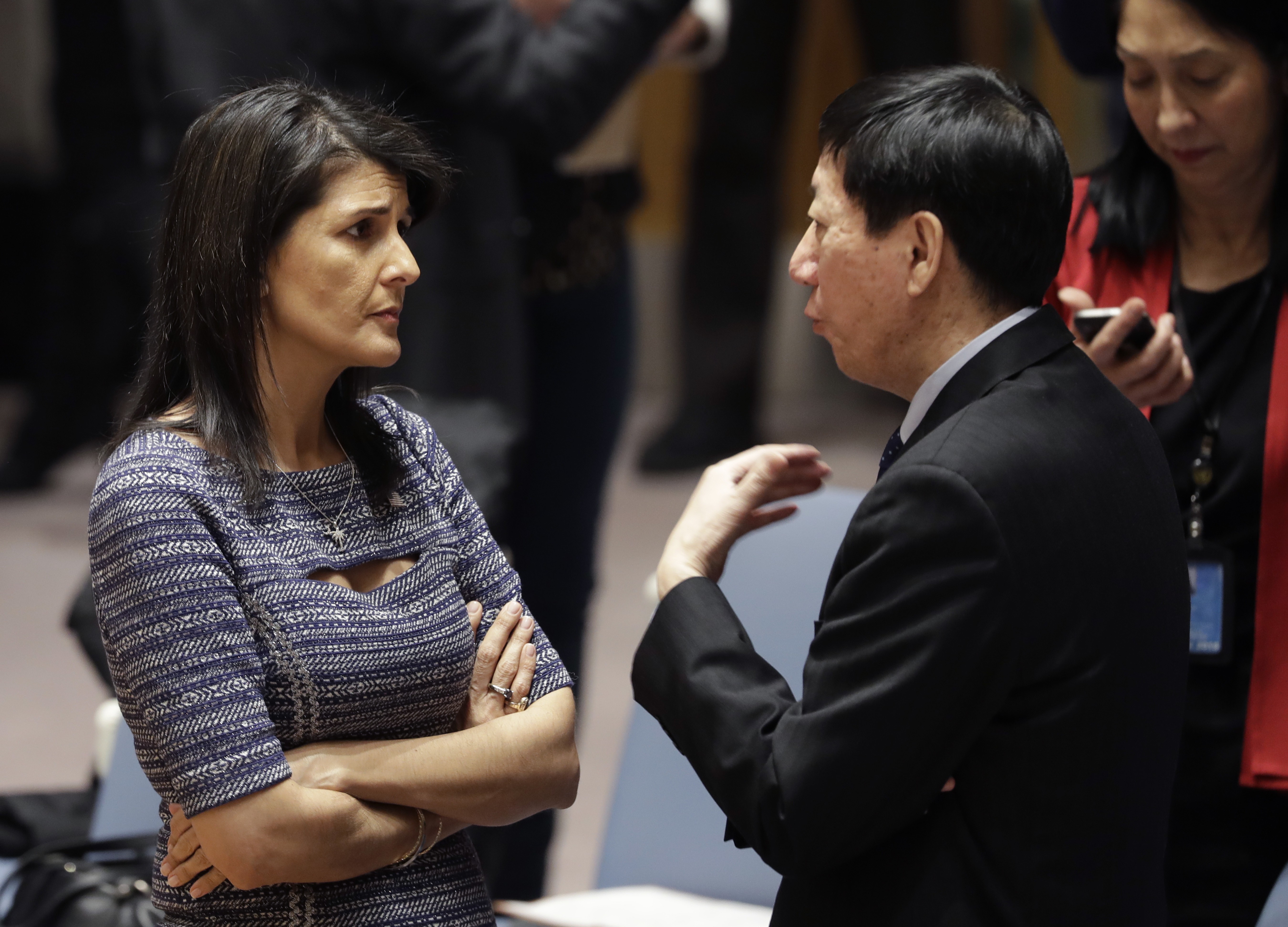 Awkward conversation: US ambassador to the UN Nikki Haley and Chinese deputy ambassador Wu Haitao. Photo: AP