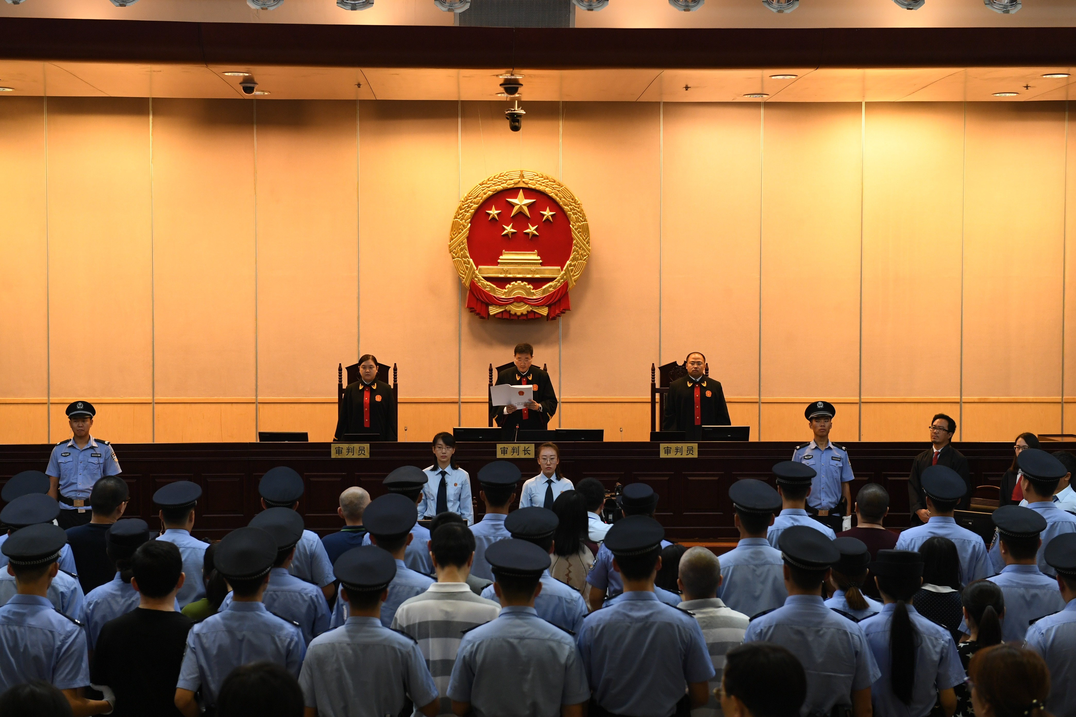 Twenty-six executives of a Chinese online peer-to-peer (P2P) lender are handed jail terms ranging from three years to life imprisonment for cheating the public out of large amount of money in Beijing. Two Chinese were sentenced to life by another court for a pyramid scheme. Photo: Xinhua