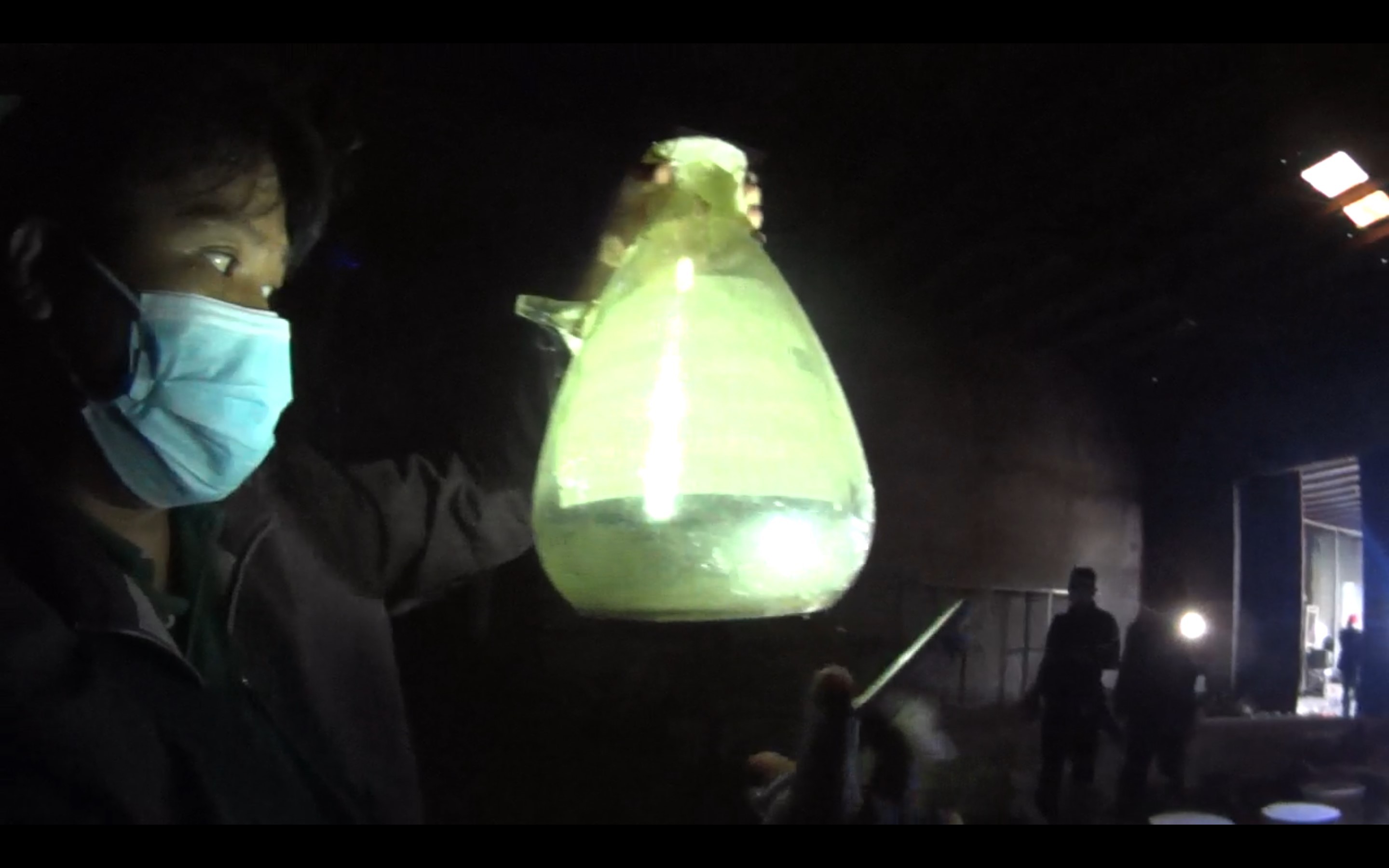 PDEA chemist Jhomar Concepcion holding a beaker containing methamphetamine. Photo: SCMP