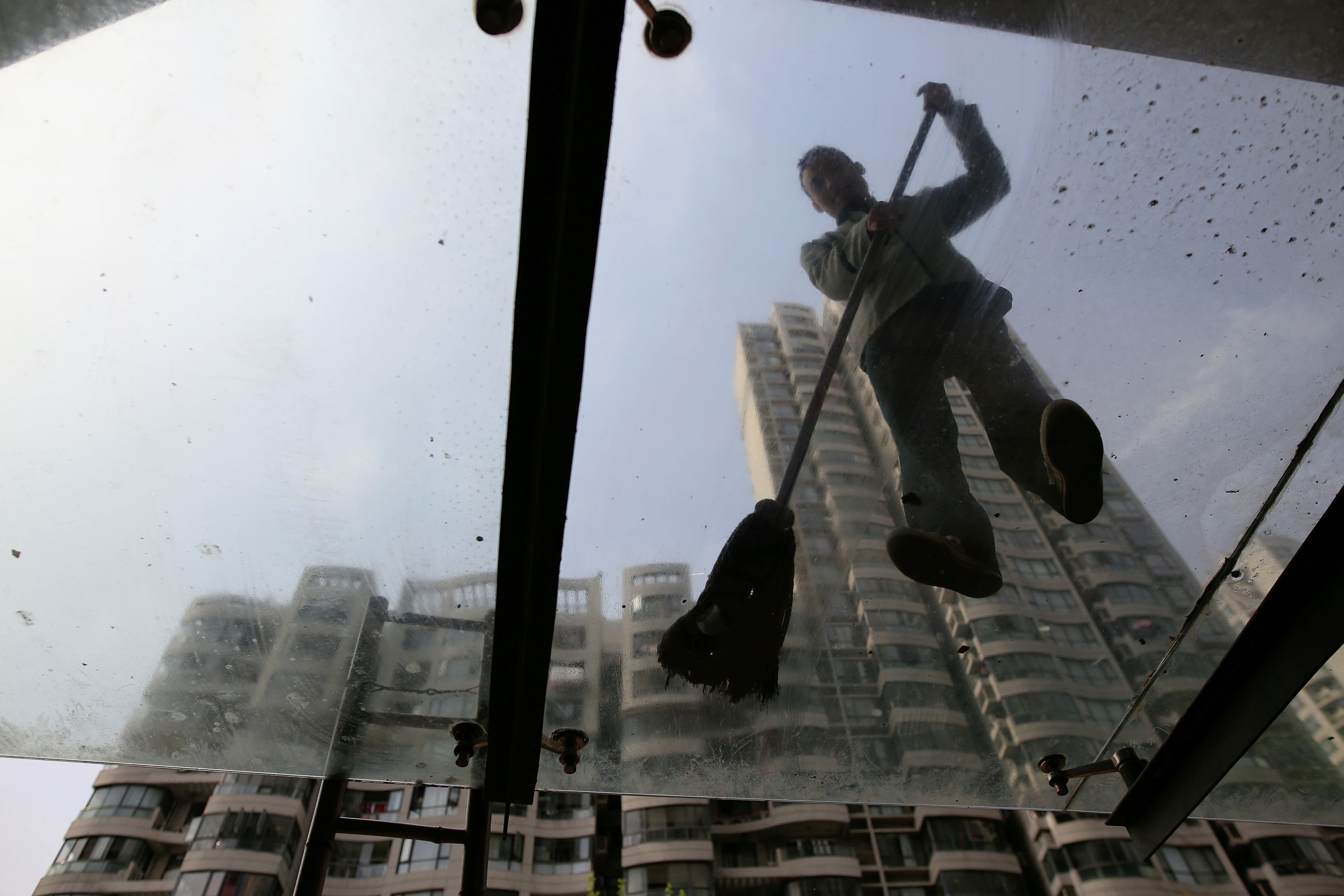 The expenses for a property management team with a portfolio of five buildings could exceed HK$400,000 a month. Photo: Reuters