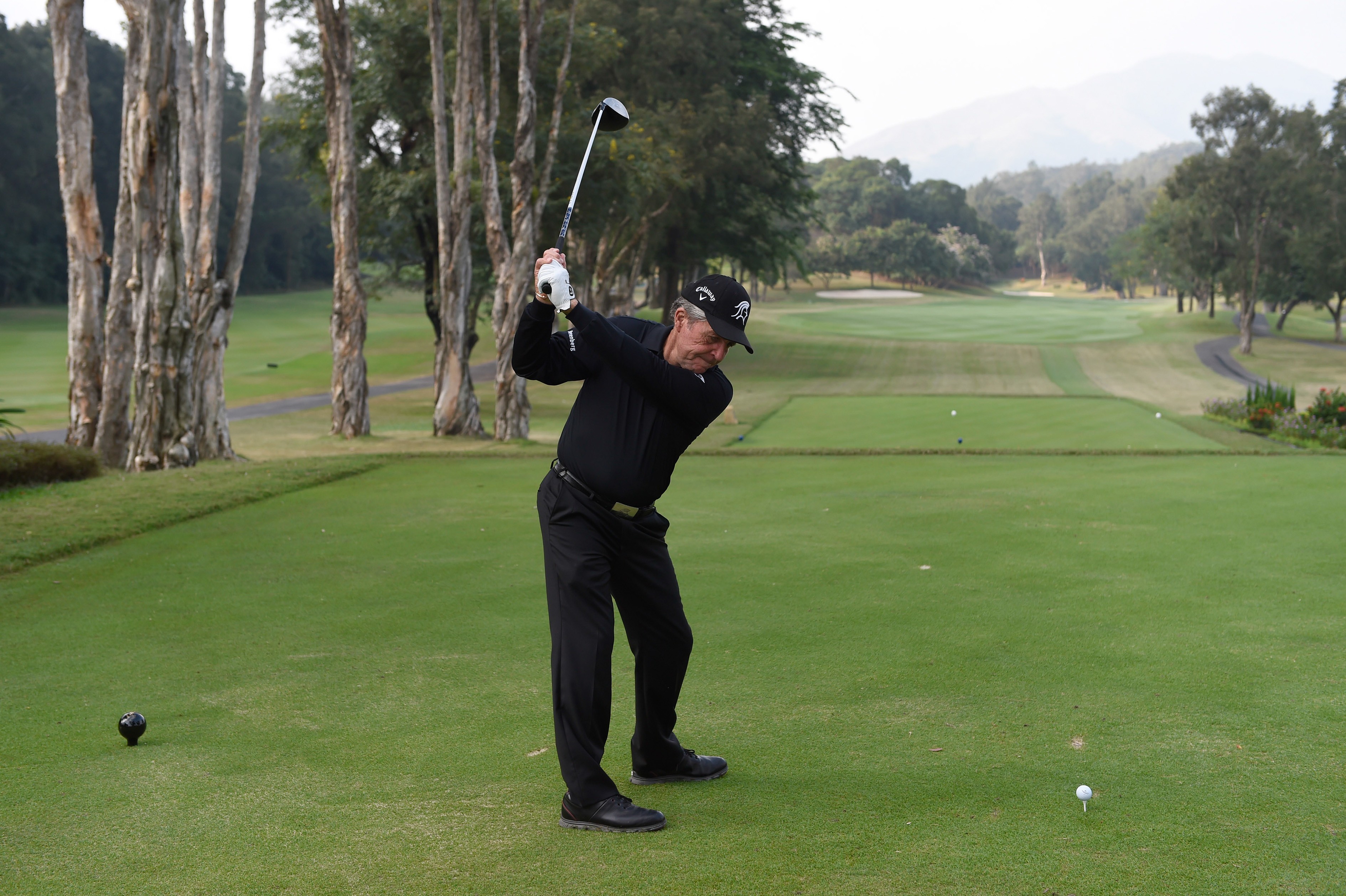 South African legend Gary Player tees off on the first hole of the Eden Course at Hong Kong Golf Club. The hole is also the first on the Composite Course used for the Hong Kong Open. Photo: Richard Castka/Sportpixgolf.com.