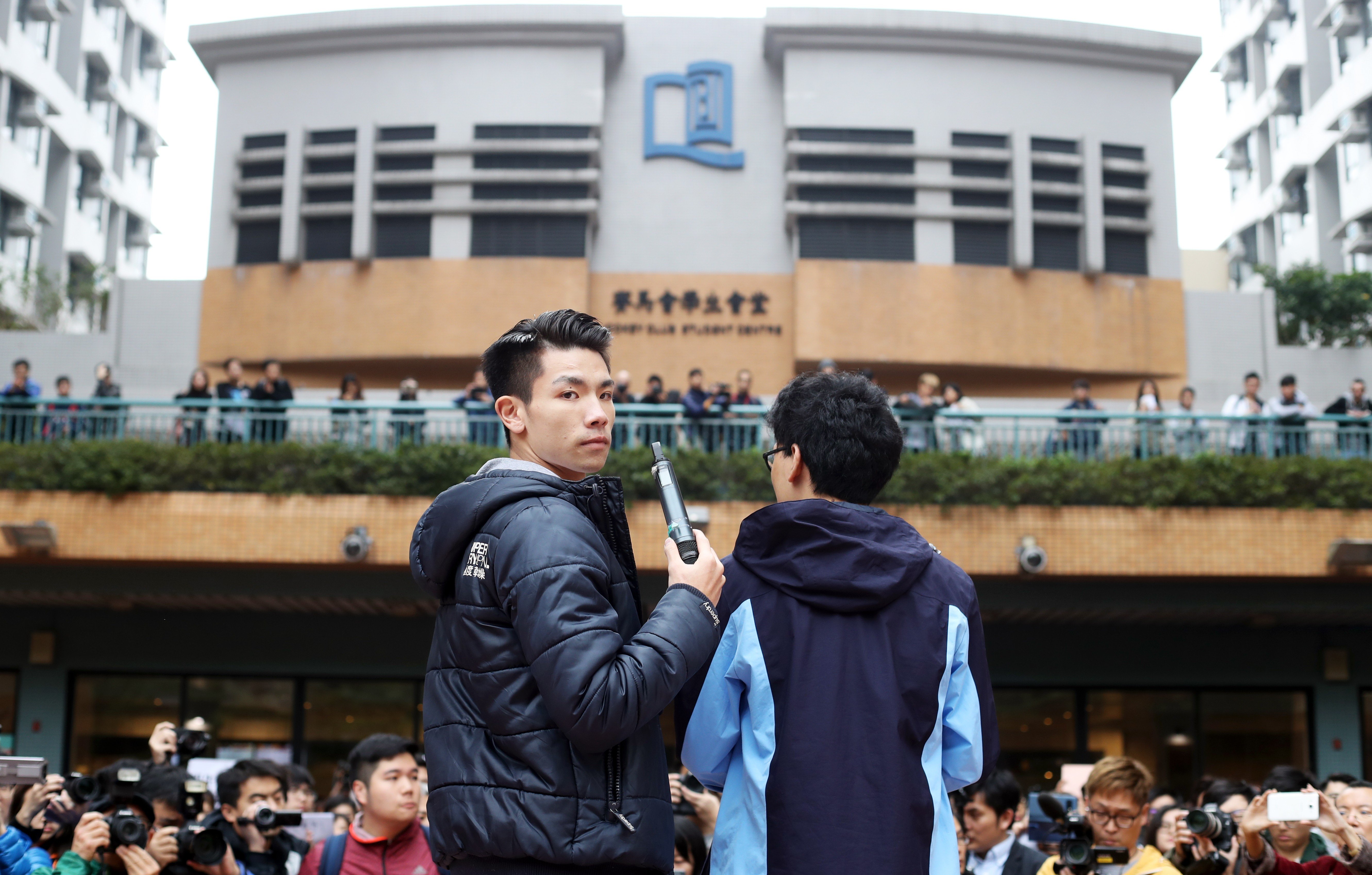 Student union leader Lau Tsz-Kei (left) and Andrew Chan speak during the protest. Photo: Winson Wong