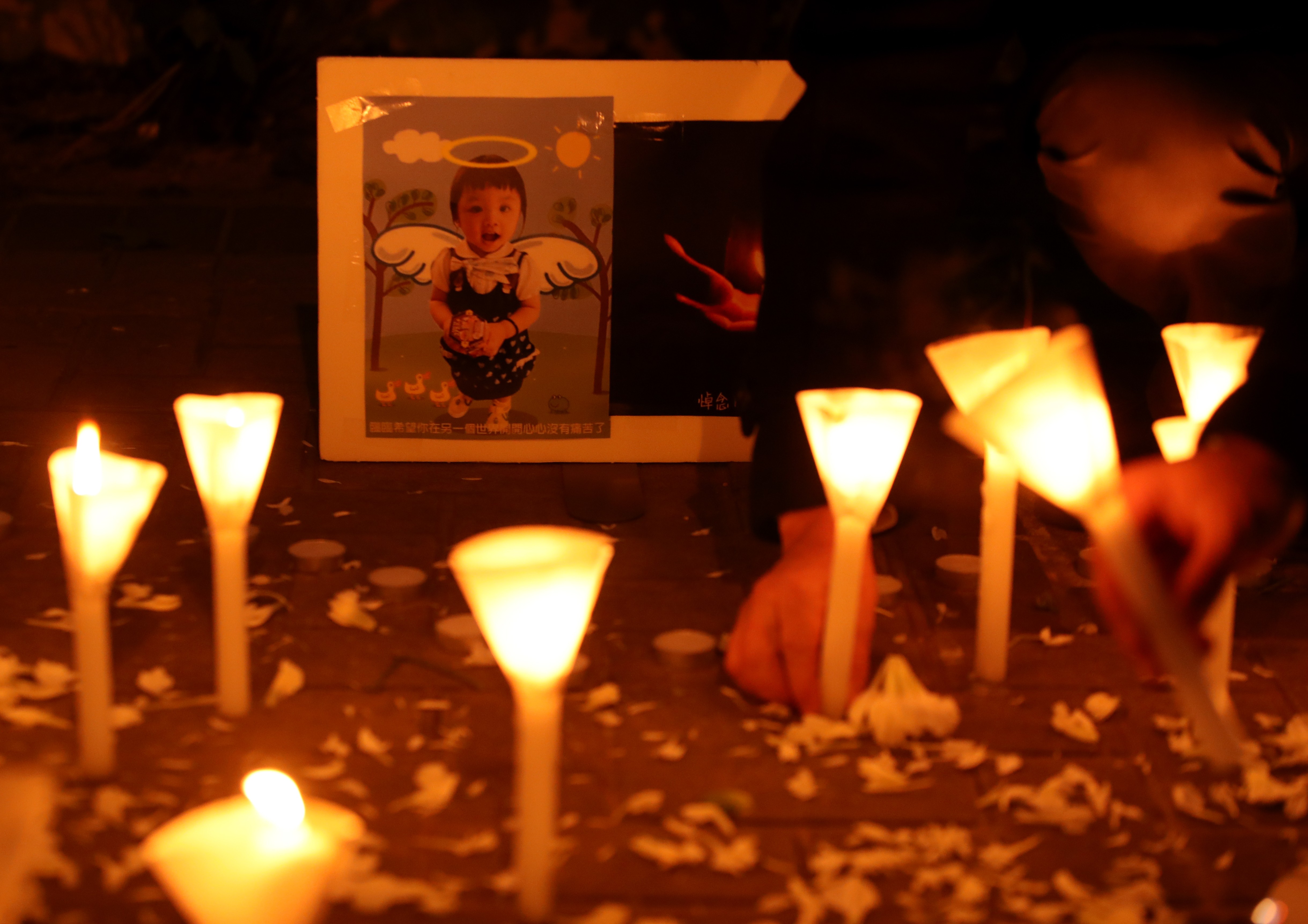Mourners take part in a candlelight vigil for five-year-old girl Chan Sui-lam, who died on January 6. Photo: Handout