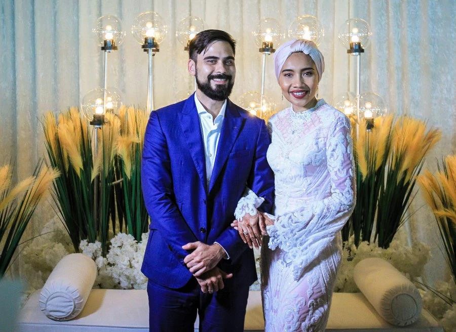 Newly married Malaysian singer-songwriter Yuna (right) with her husband Adam Yousof Sinclair. Photo: Asyraf Hamzah